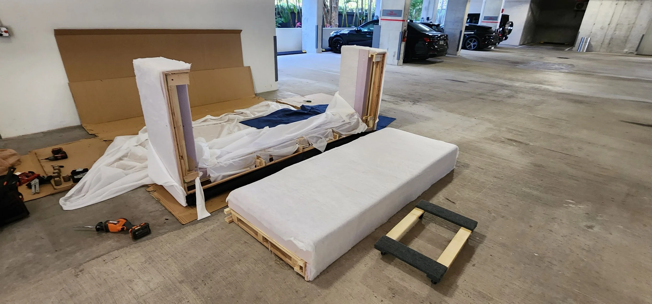 Oversized RH sofa disassembled and reassembled for tight access
