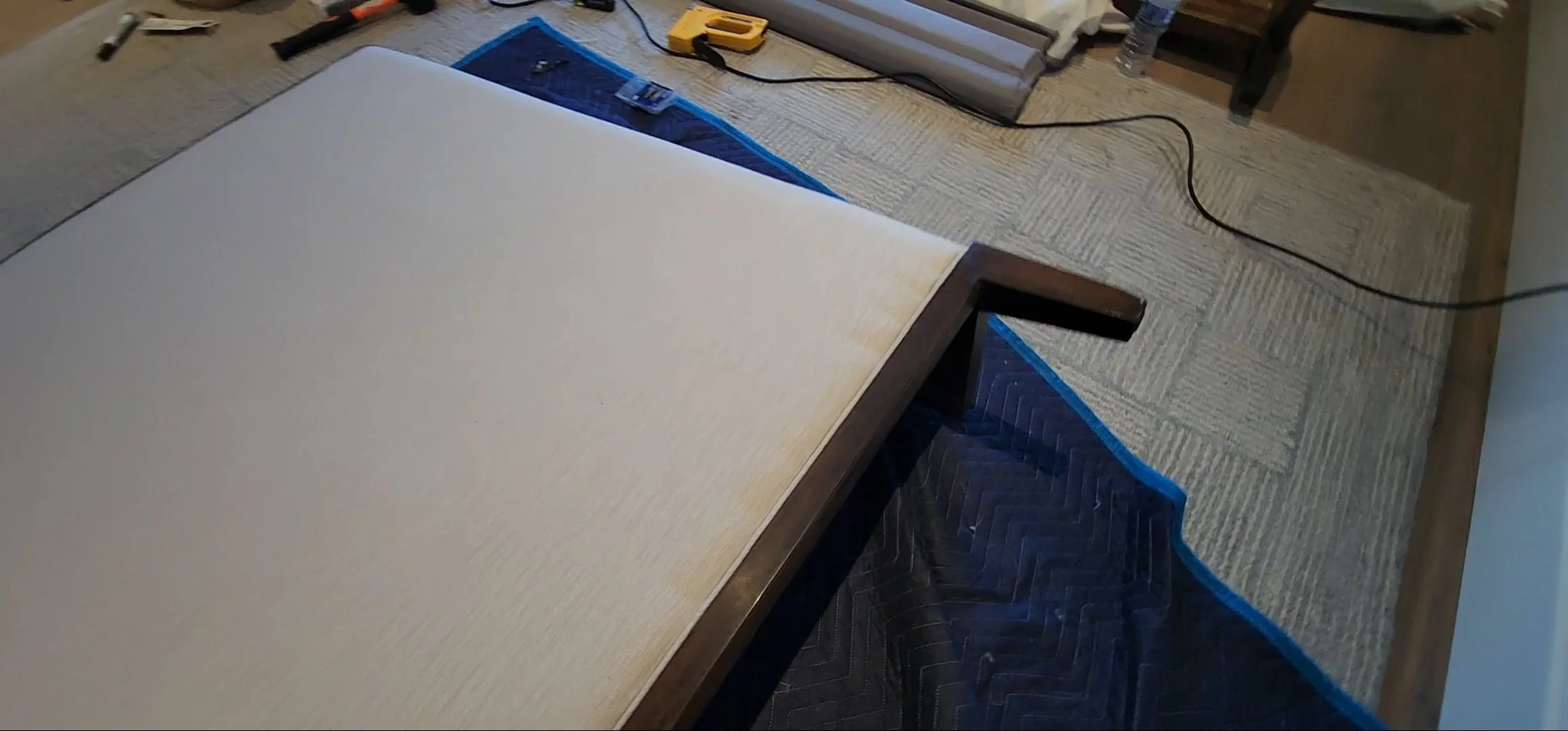 High-rise furniture specialists installing luxury headboard