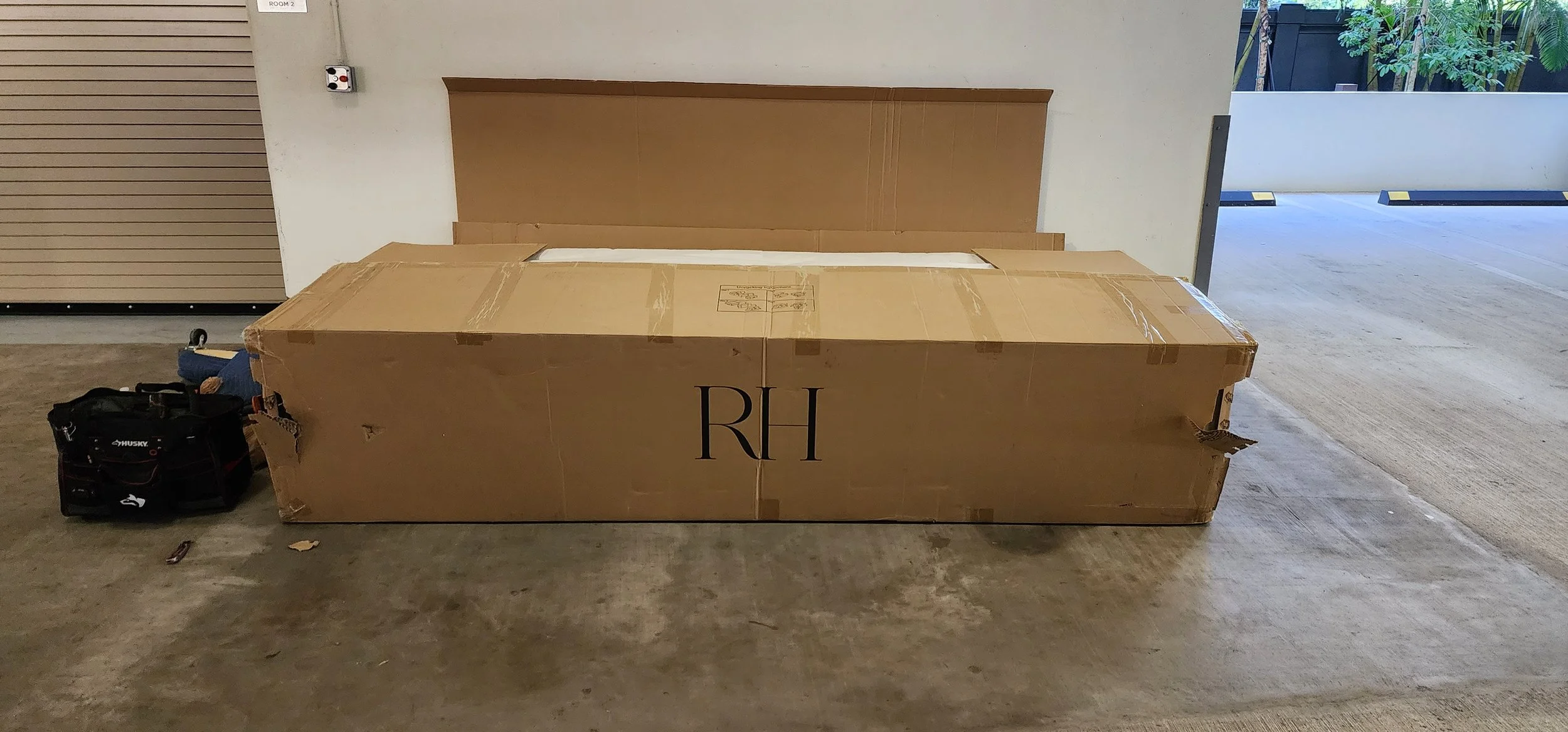 Professional Restoration Hardware furniture specialists handling oversized sofa