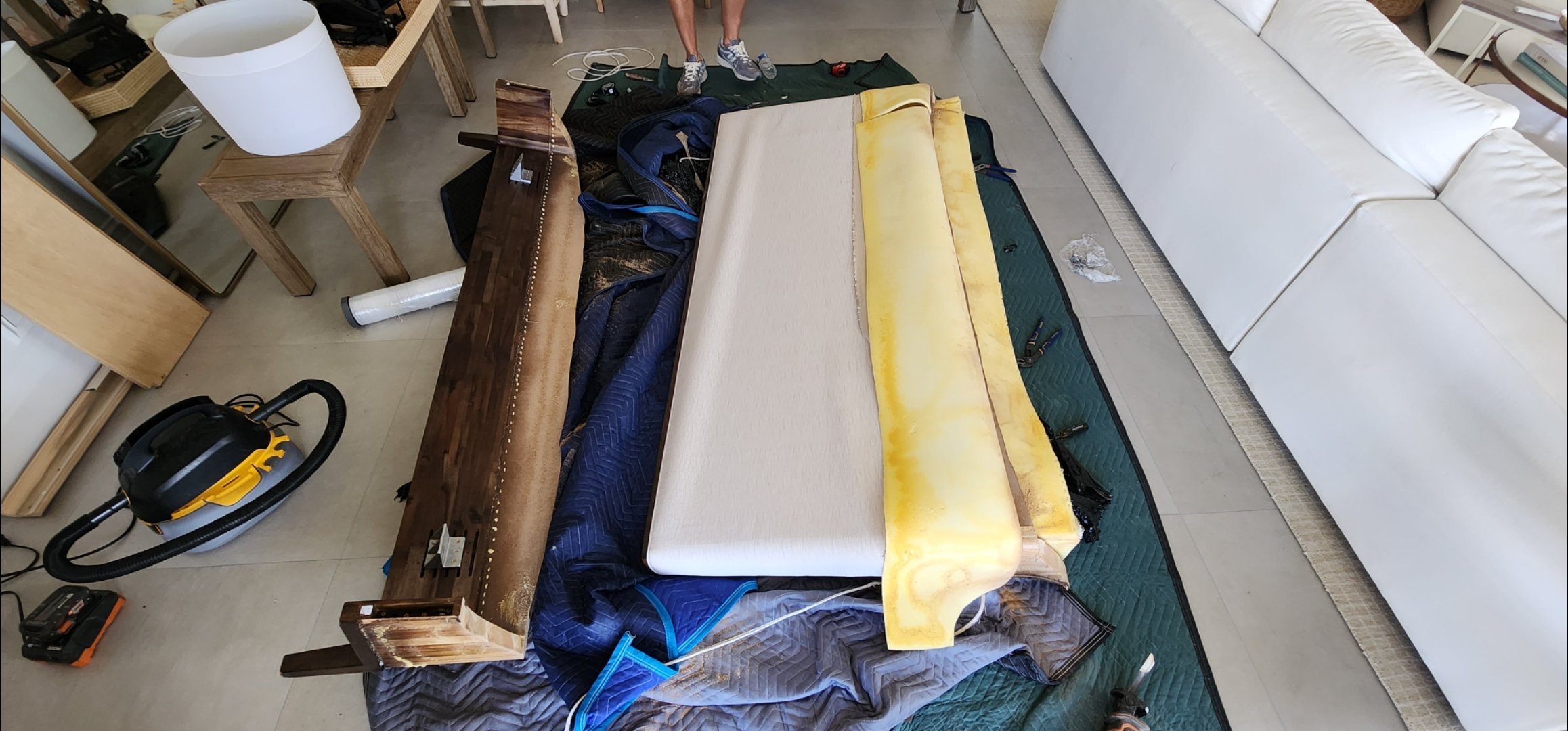 Large upholstered headboard delivered through a narrow elevator