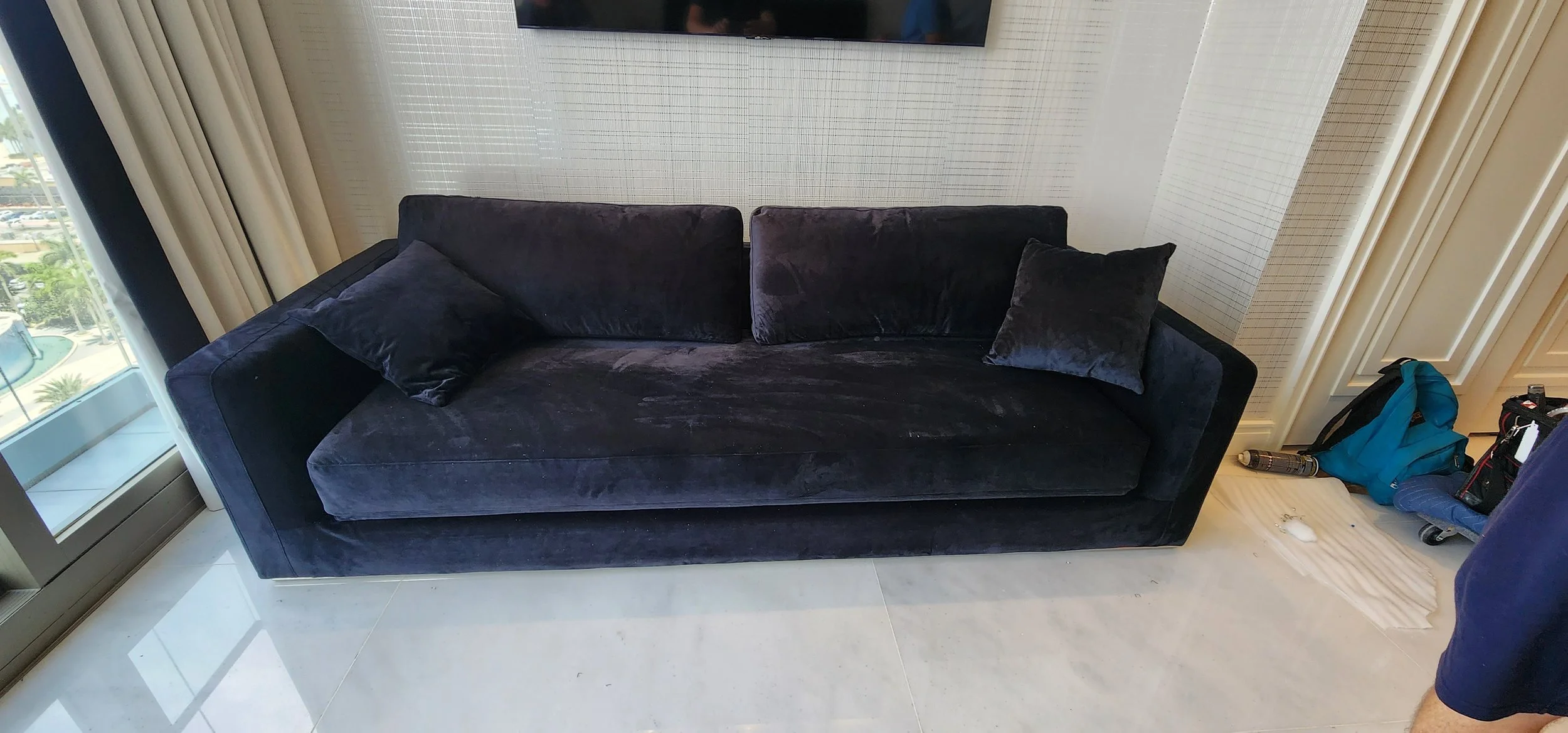 Oversized furniture successfully fitted into a tight condo space