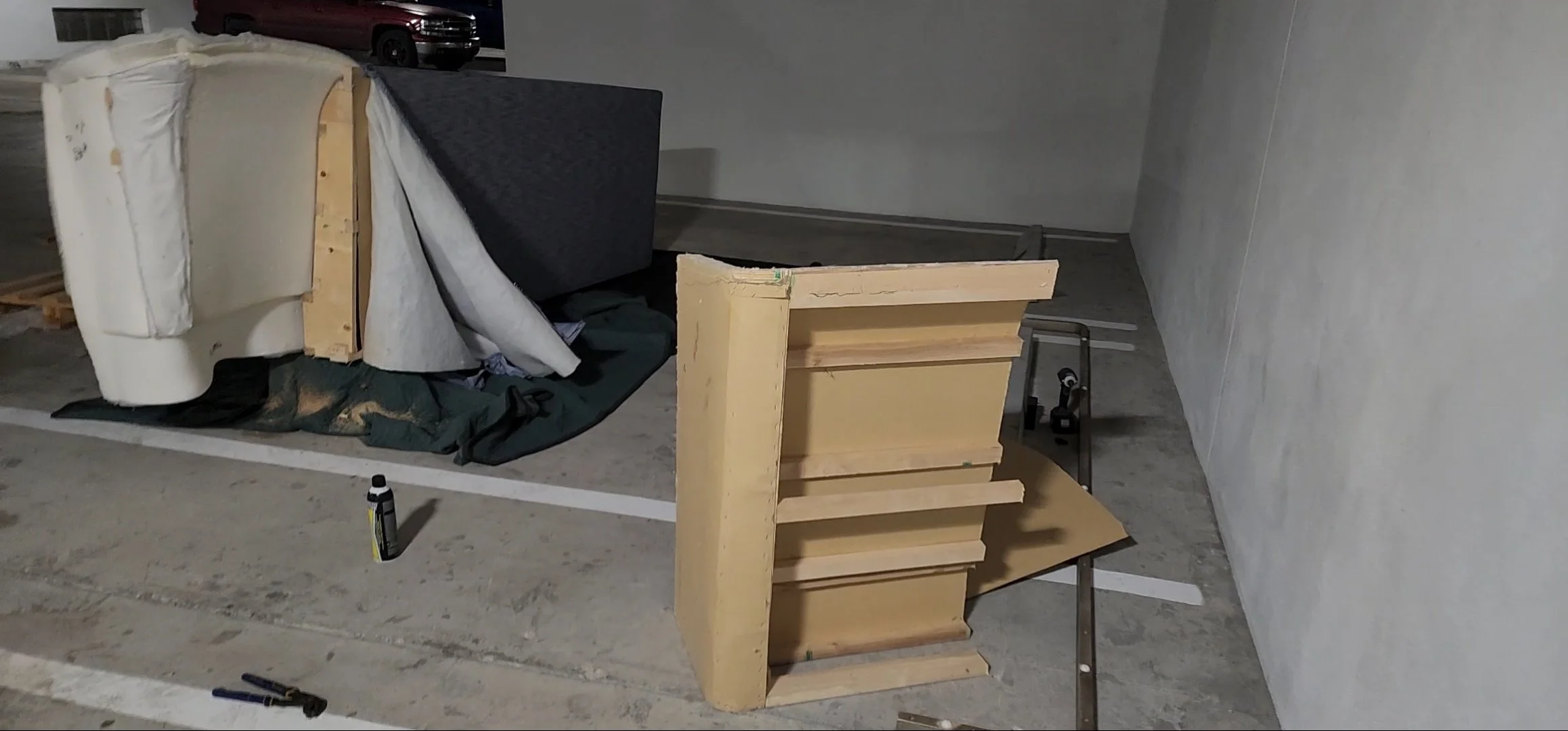 Large Restoration Hardware headboard carefully maneuvered through elevator