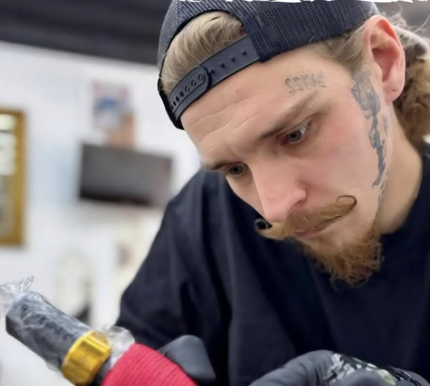 Guest tattoo artist Justin Dombroski working at Andromeda Tattoo near Saratoga Springs