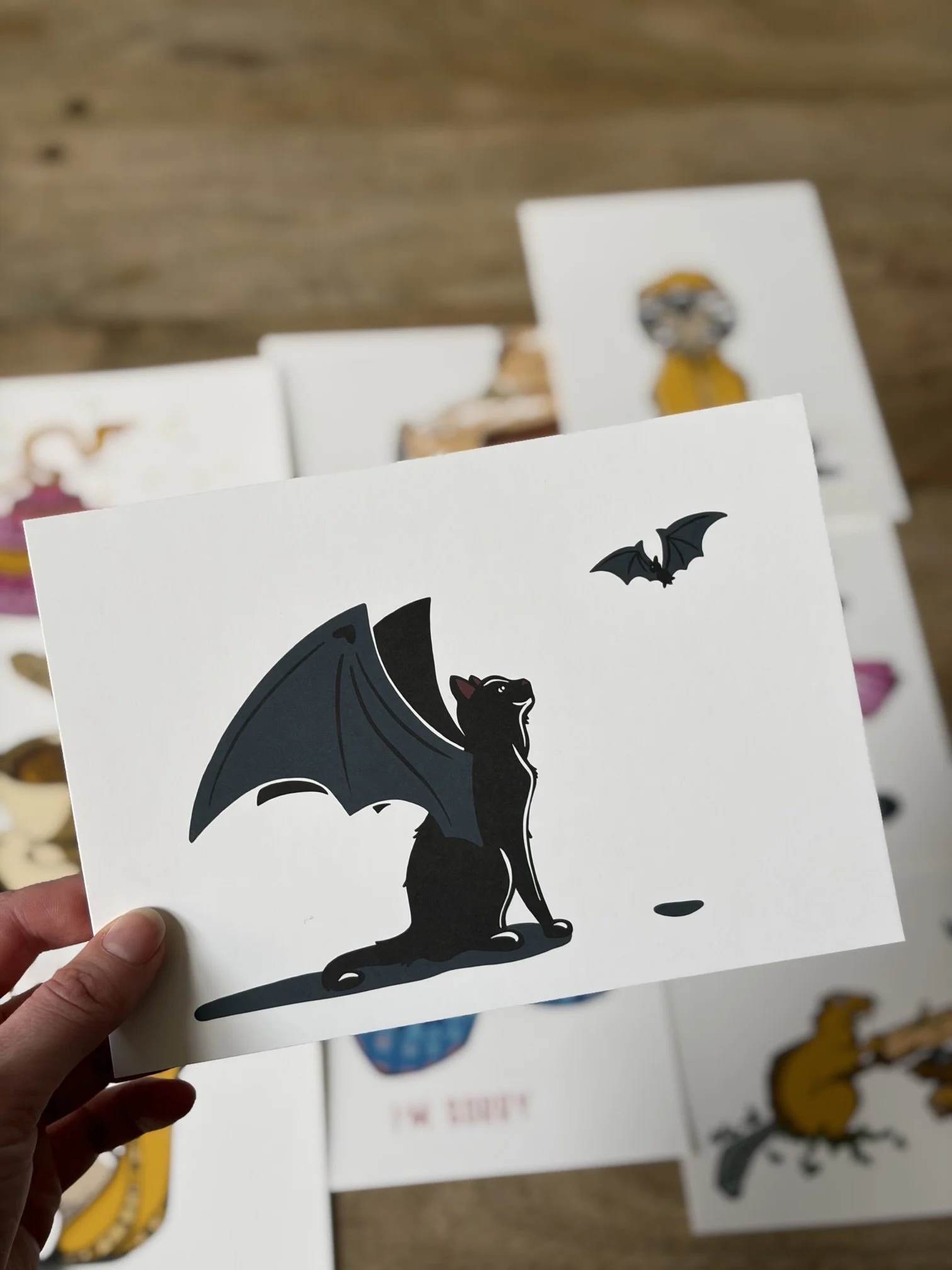 art print cat with a bat