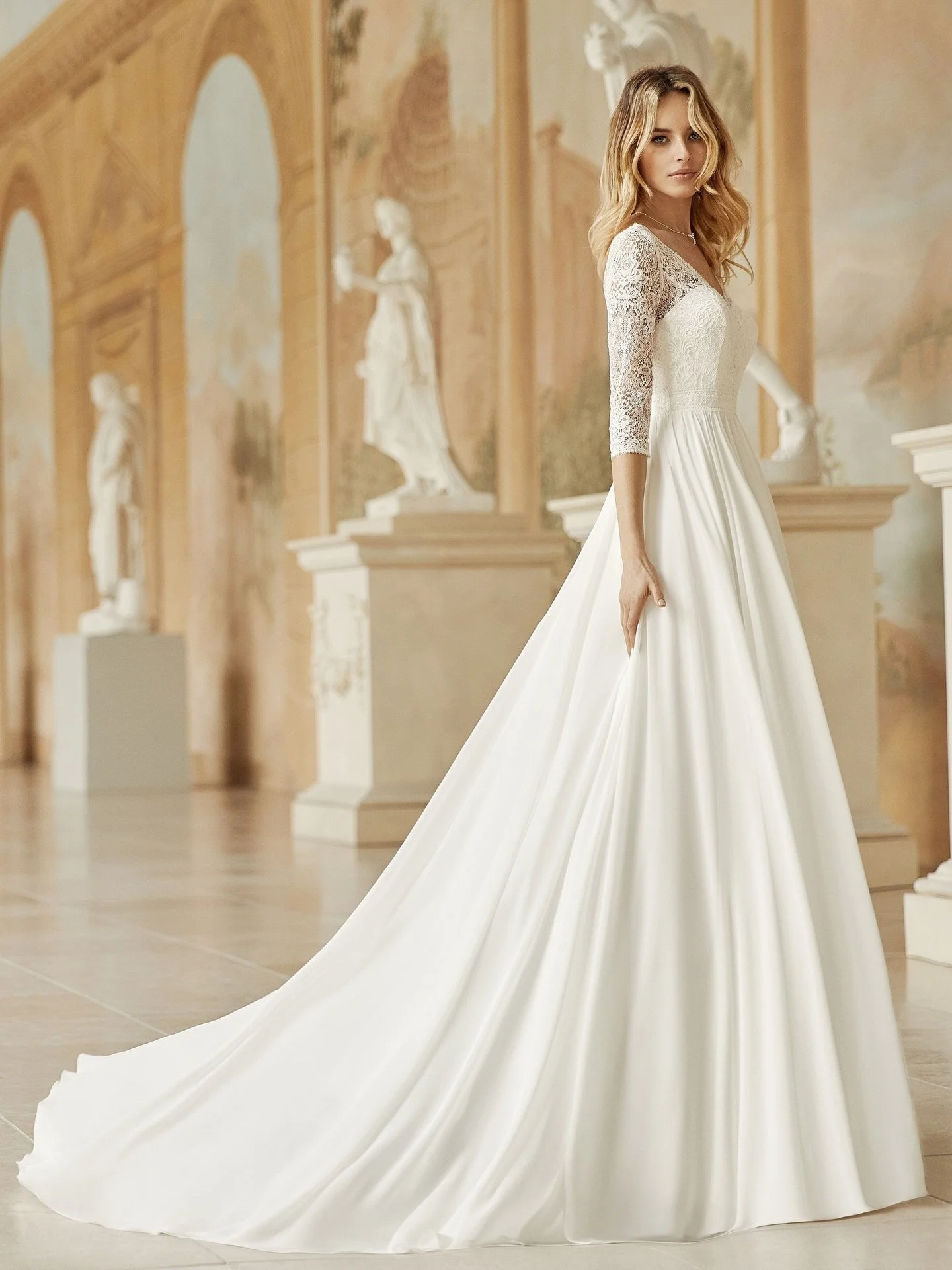 Medusa is a classic wedding dress made from lovely lace and free-flowing chiffon. Medusa ticks all the boxes for your perfect day with her 3/4 sleeve and V-shape front and back