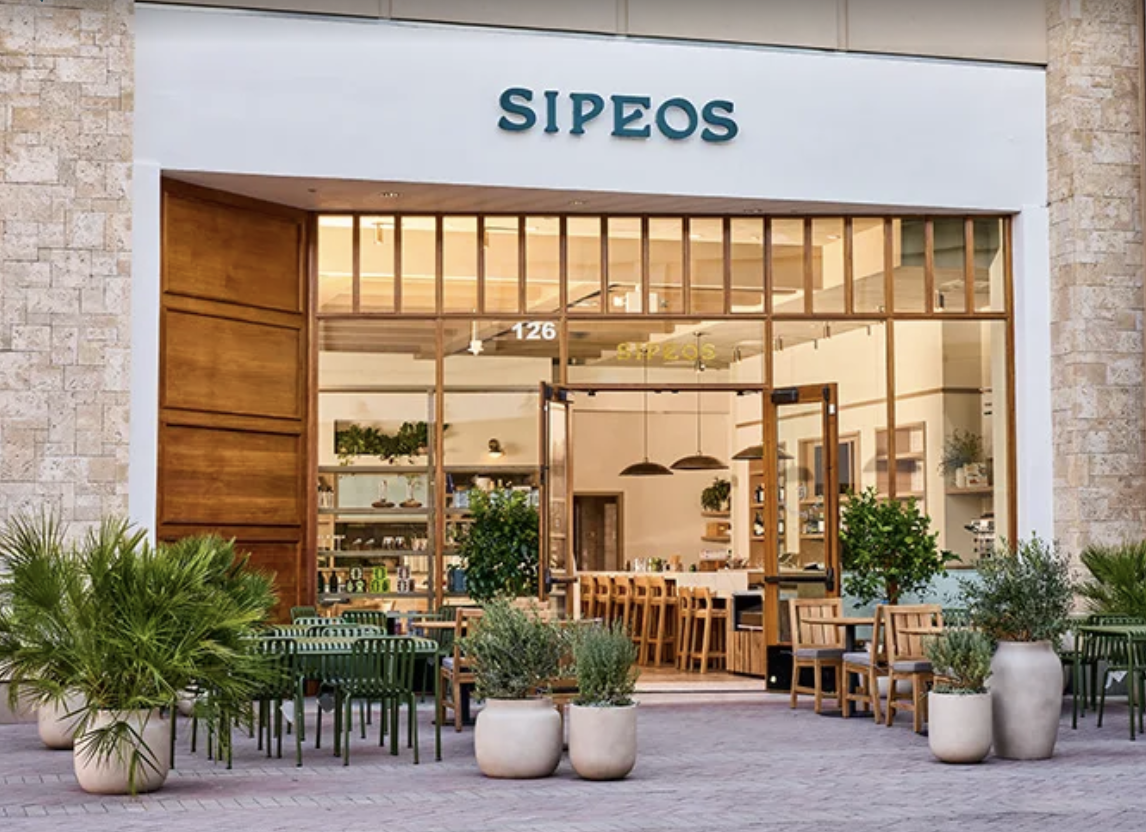 Sipeos restaurant facade, at dusk, outdoor seating, low light