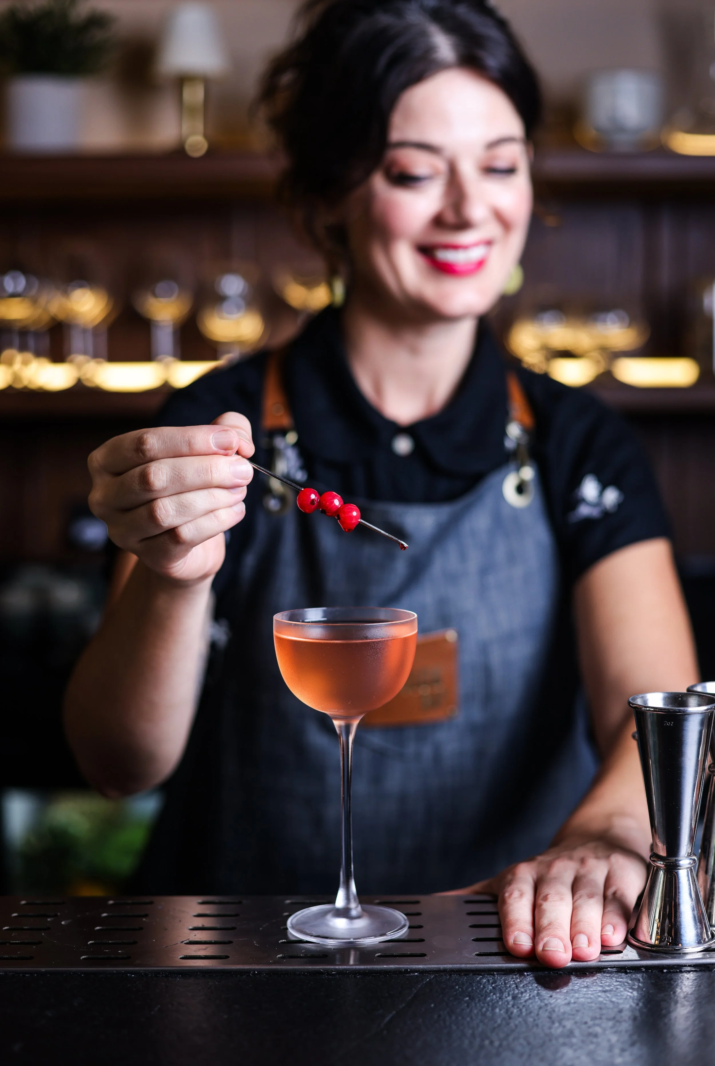 Nora Furst puts the finishing touches on a cocktail at The Mission Bay in Delhi, India