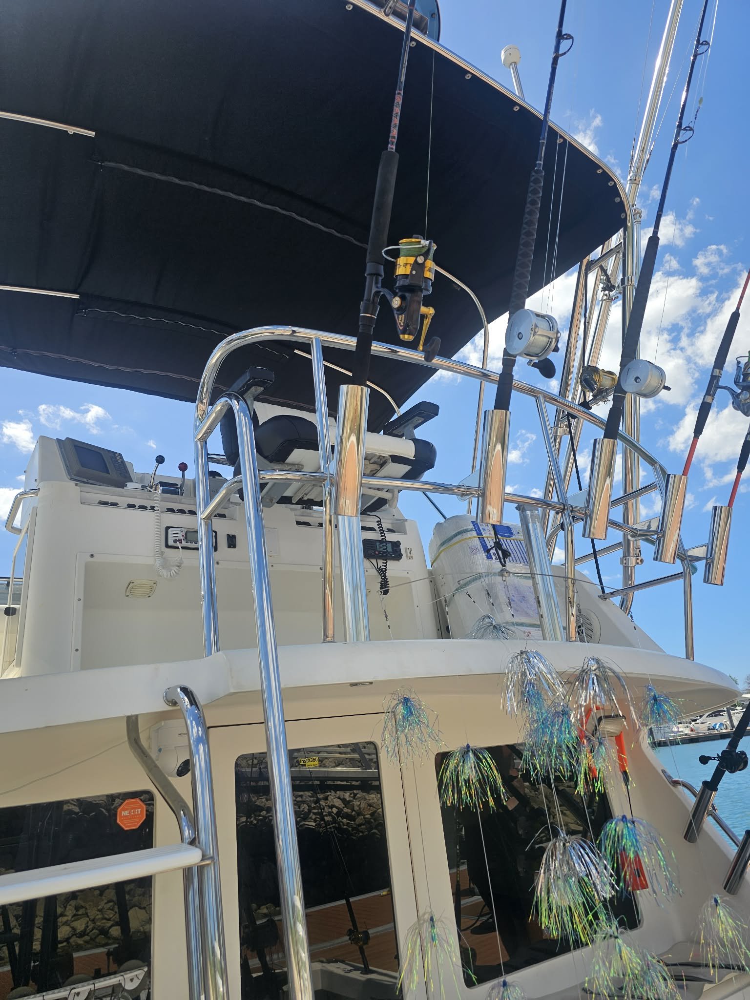 Fish Tale 2 fishing charter boat with inshore rods and canopy docked at marina flamingo J6 in Guanacaste Costa Rica