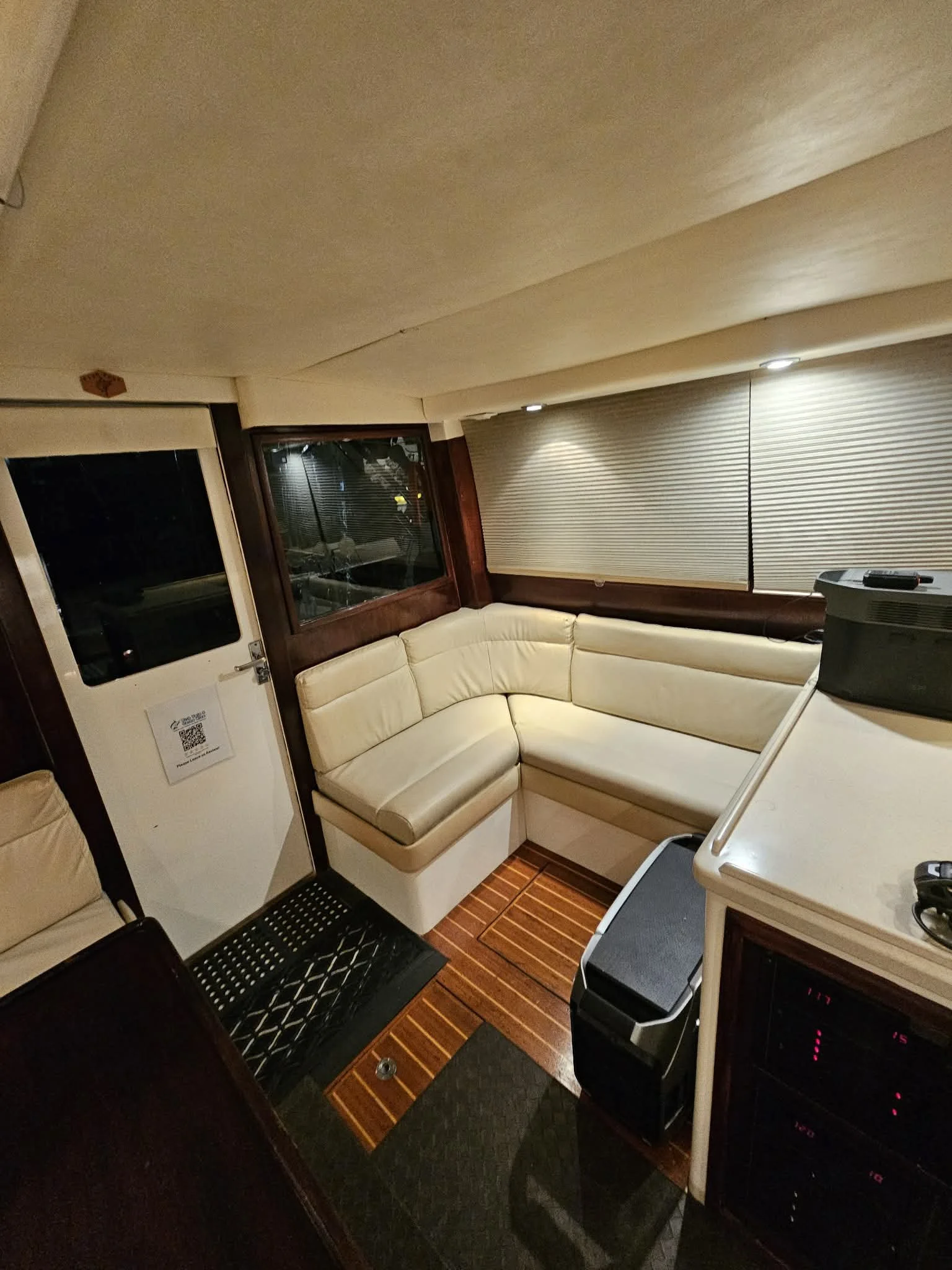Interior of Fish Tale 2 cabin with seating, flooring, and onboard electronics during Costa Rica fishing charter