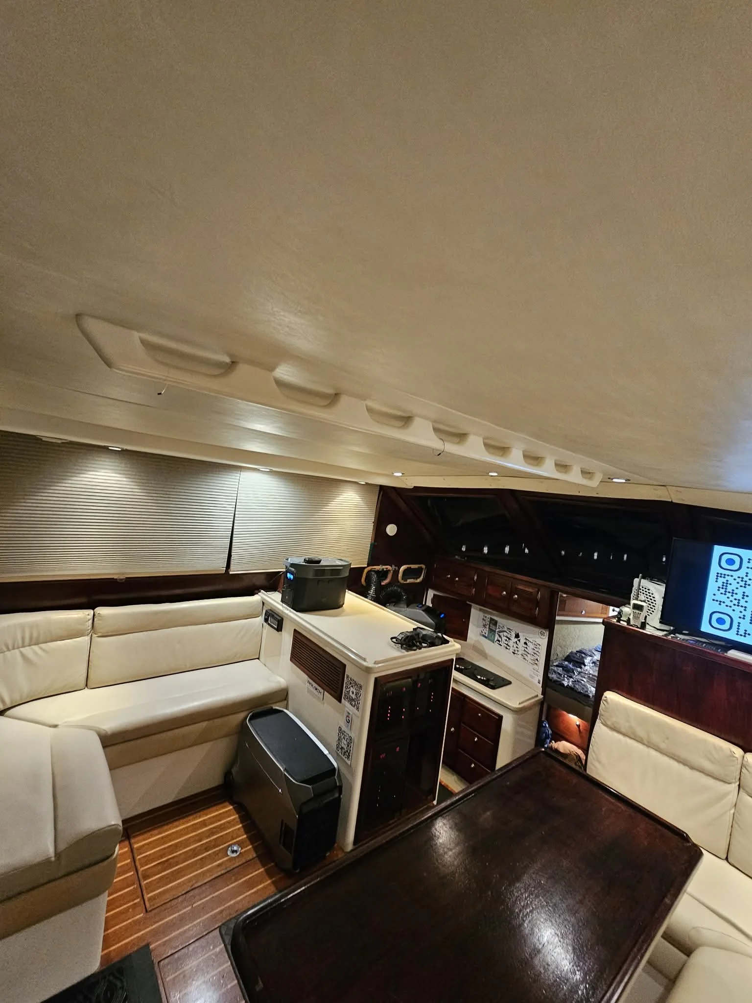 Fish Tale 2 cabin interior with seating, table, and electronics designed for comfort on a private Costa Rica fishing charter