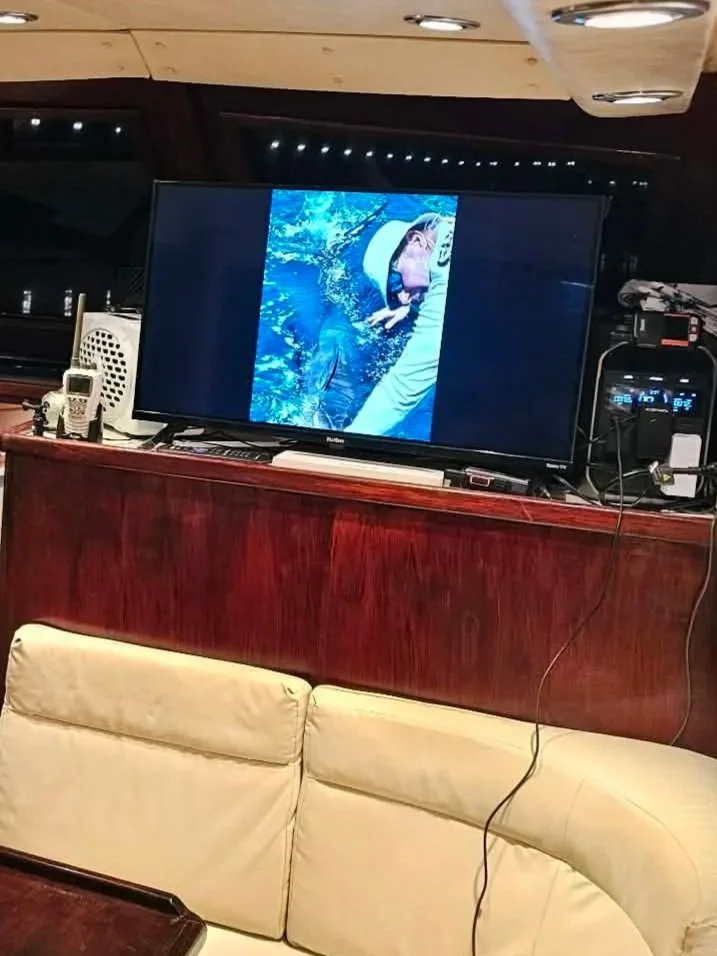 Fish Tale 2 cabin interior with onboard screen and seating area designed for comfort during Costa Rica fishing trip