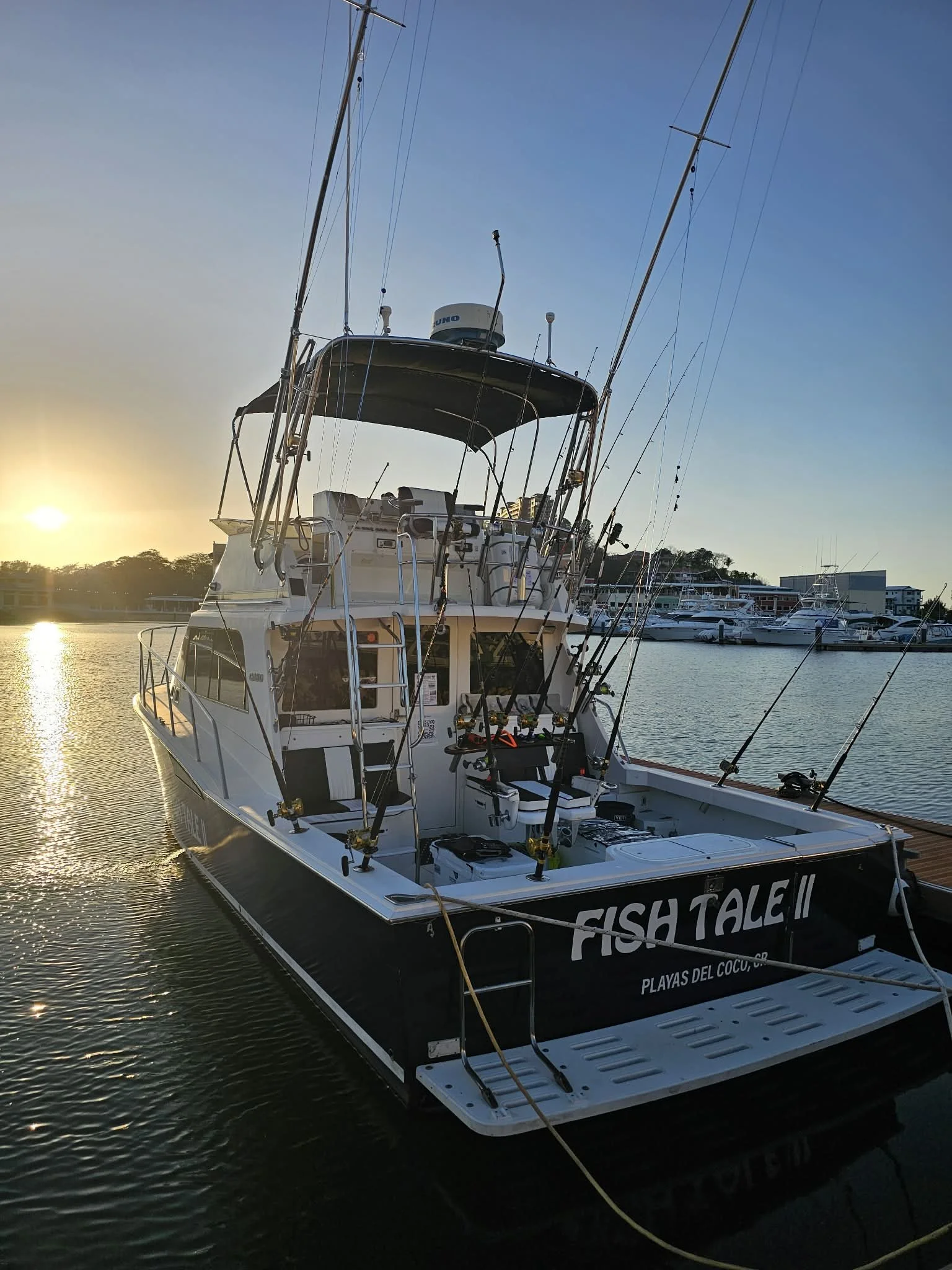 Fish Tale 2 sportfishing boat docked at the marina flamingo in Guanacaste Costa Rica at sunset with full fishing setup ready
