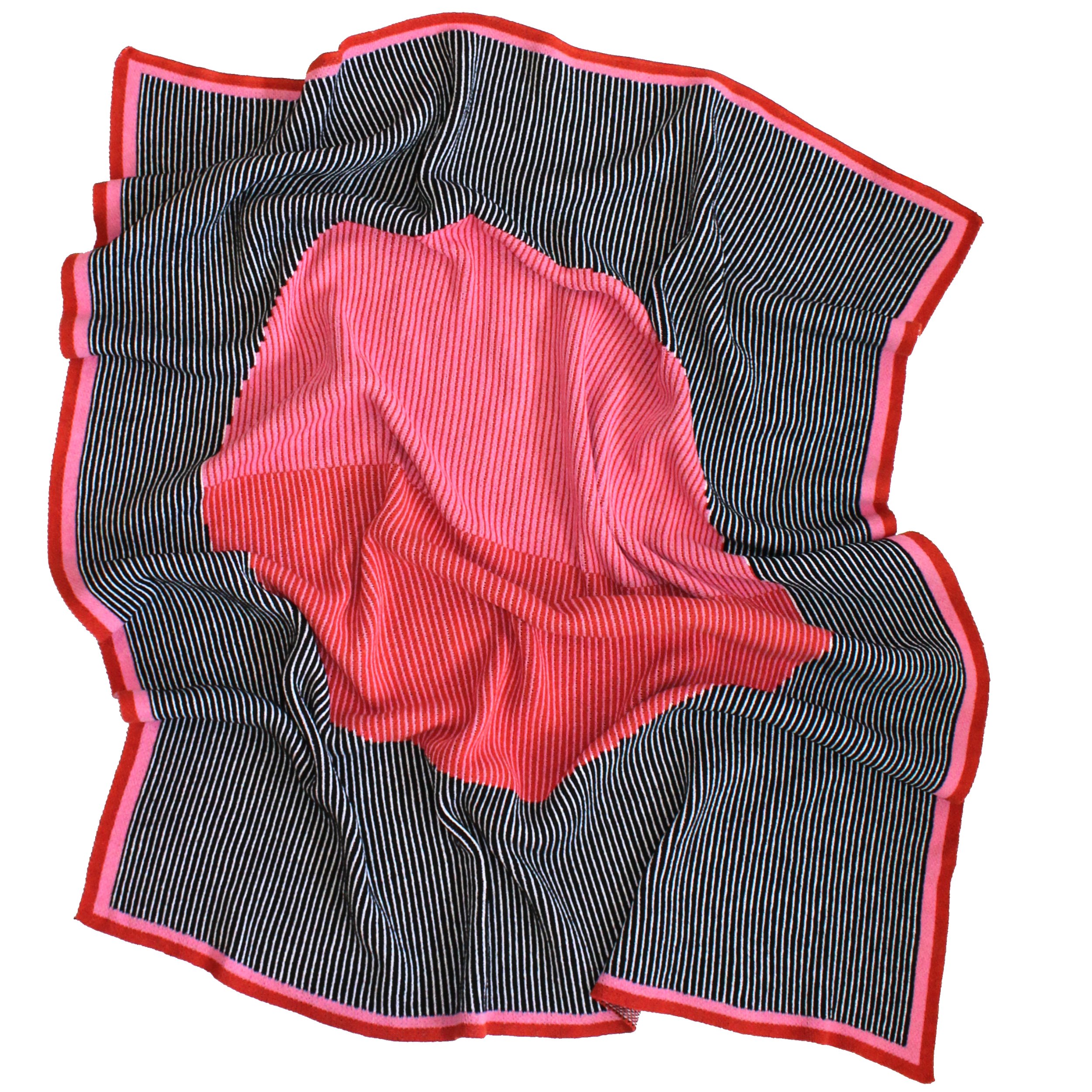 Mega Dot Throw Blanket with Big Red and Pink dot in the center and a black and white background