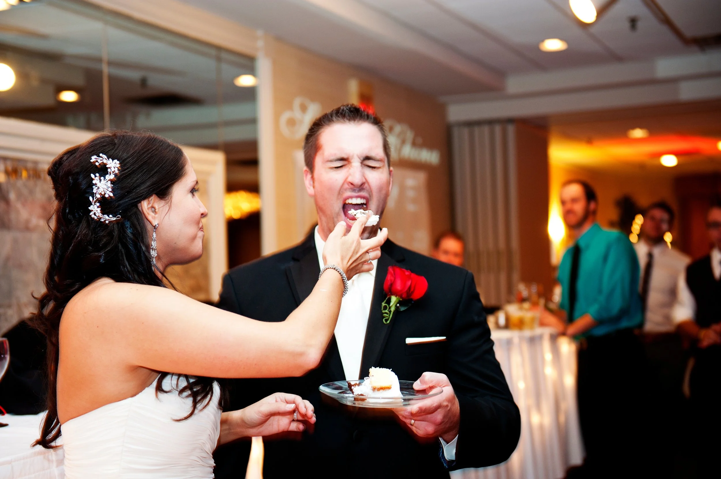 Eating cake in Malibu at their wedding 