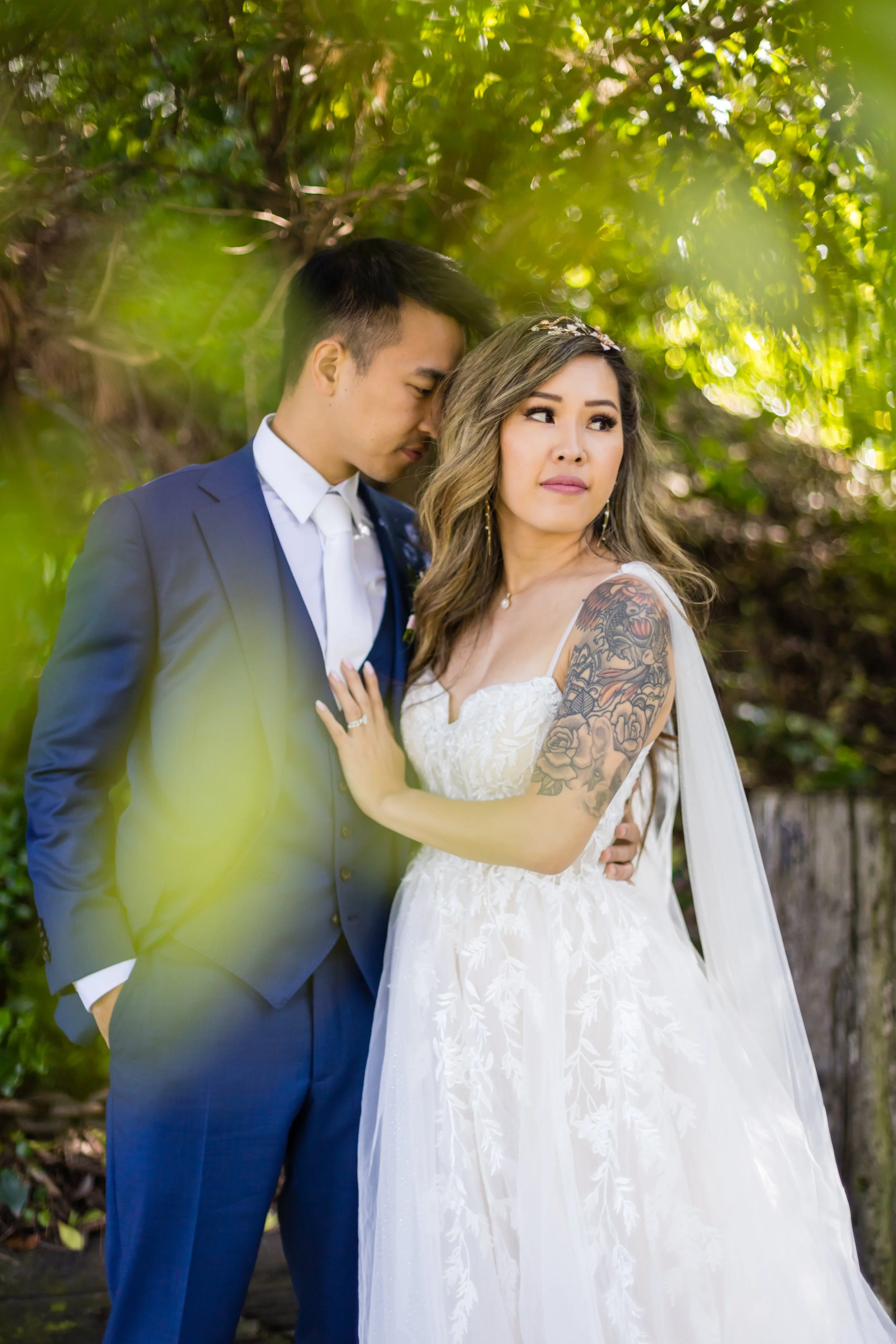 Bride and groom sharing a natural moment during their wedding portraits