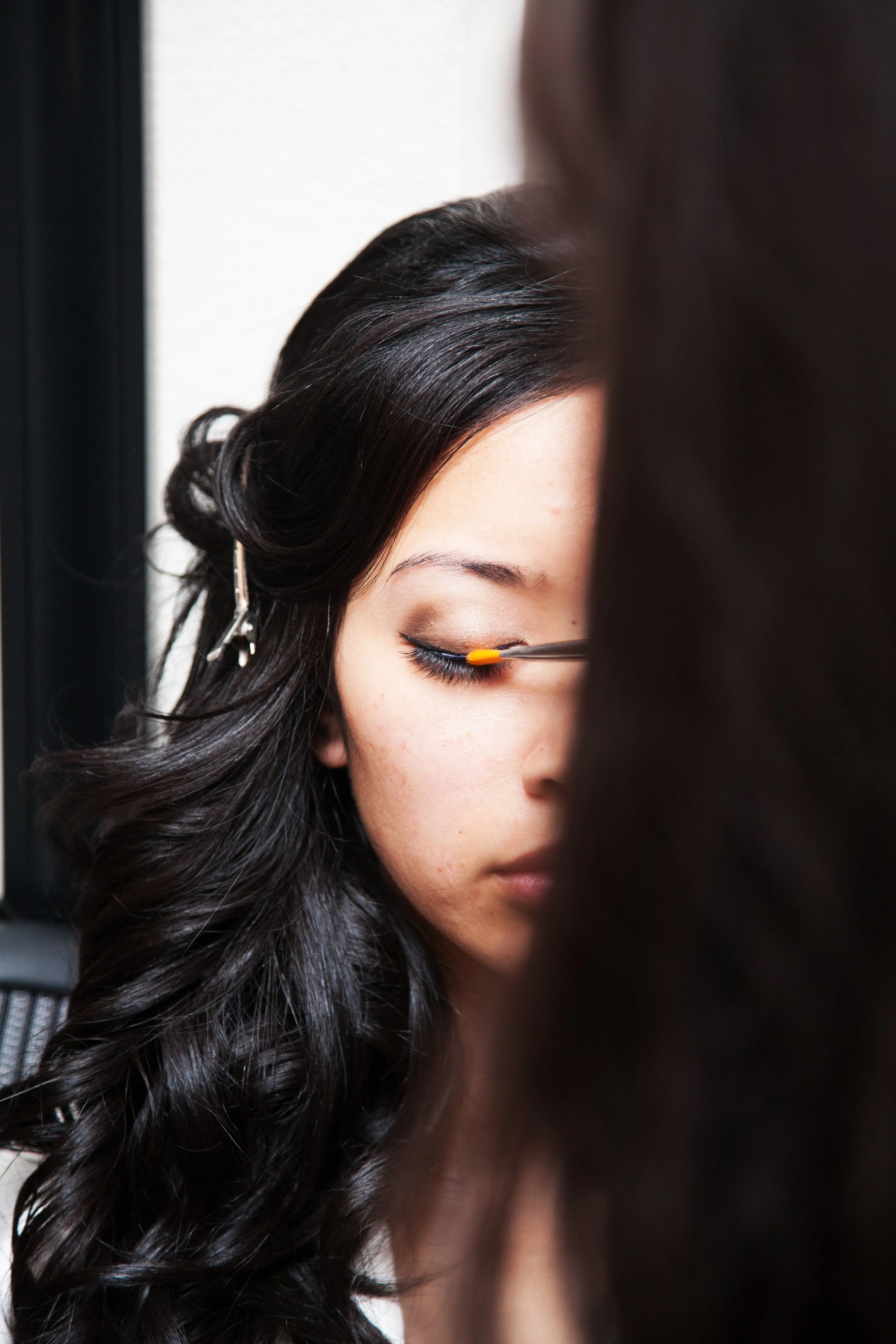 Bride getting ready with bridesmaids before an Orange County wedding