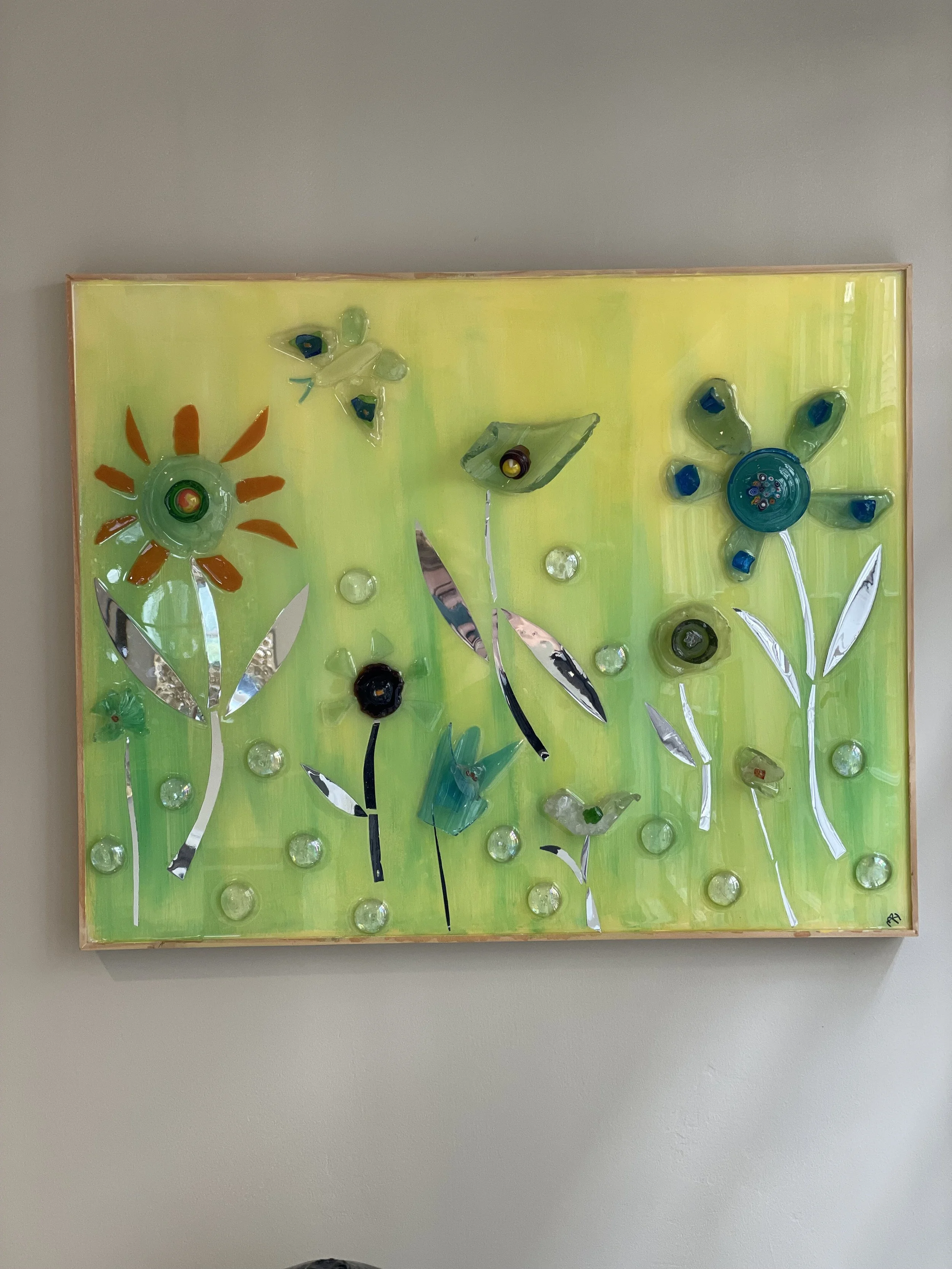 This 12X16 resin piece was created out of beach glass I collected long ago. The piece has a whimsical air with a shiny finish.