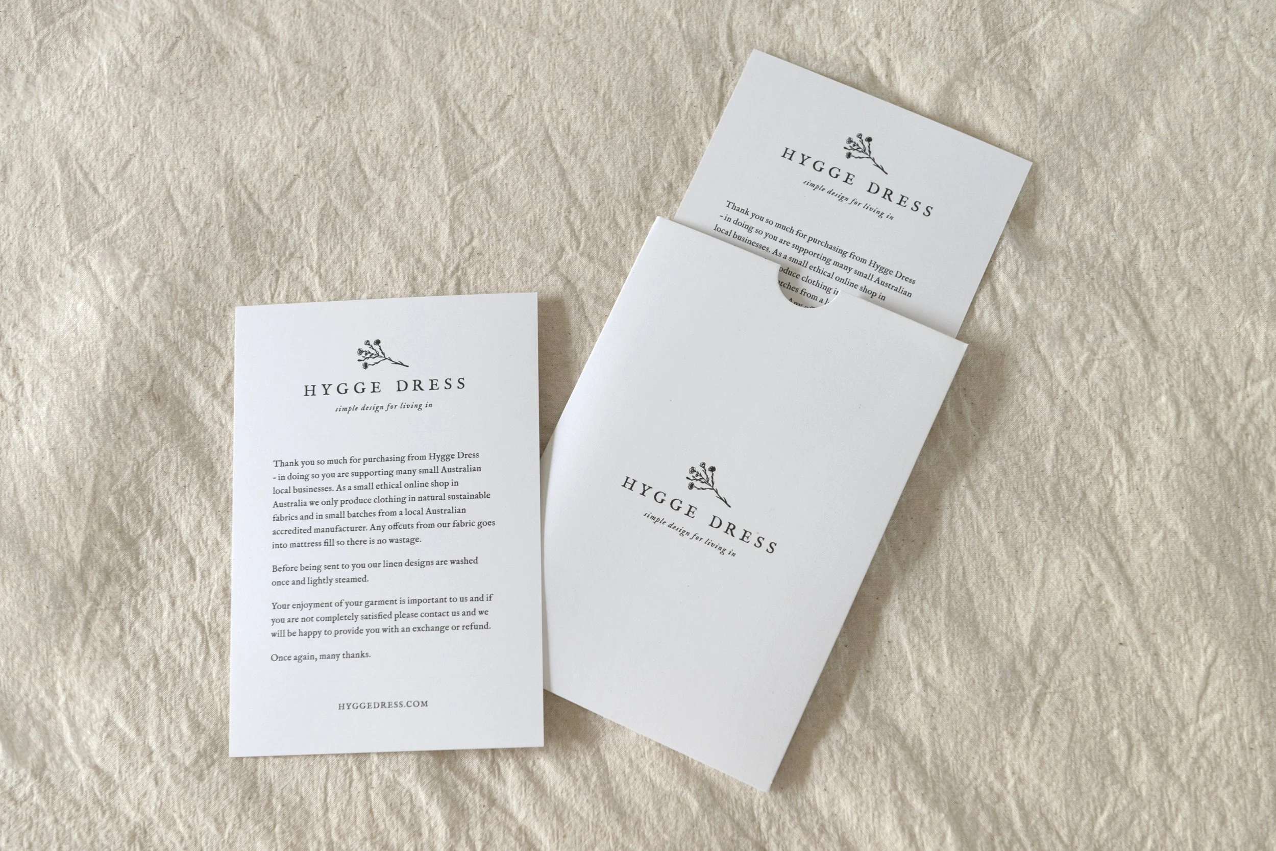 Thank you cards lying on a calico background.