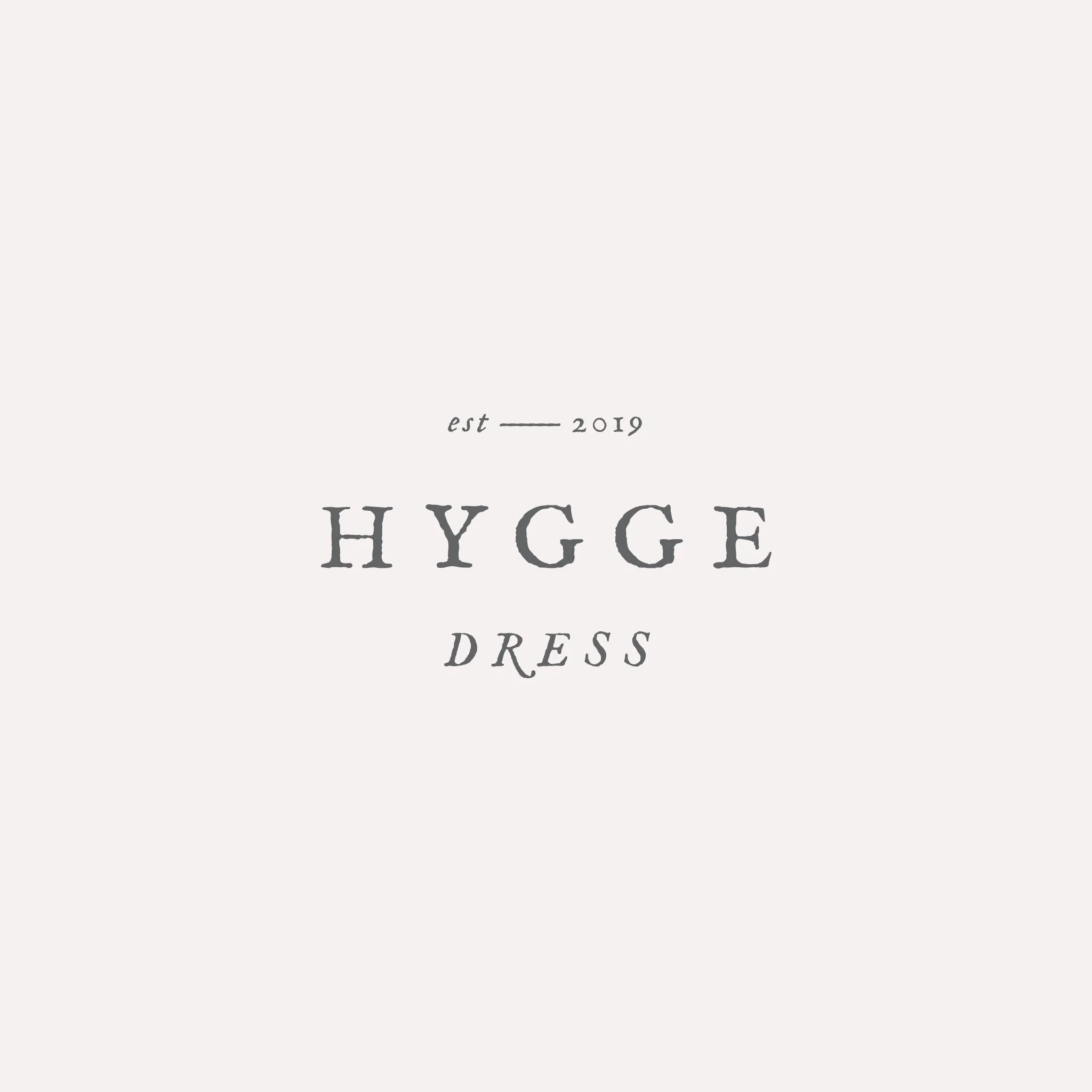 Submark logo reading Hygge Dress designed by Foster Creative