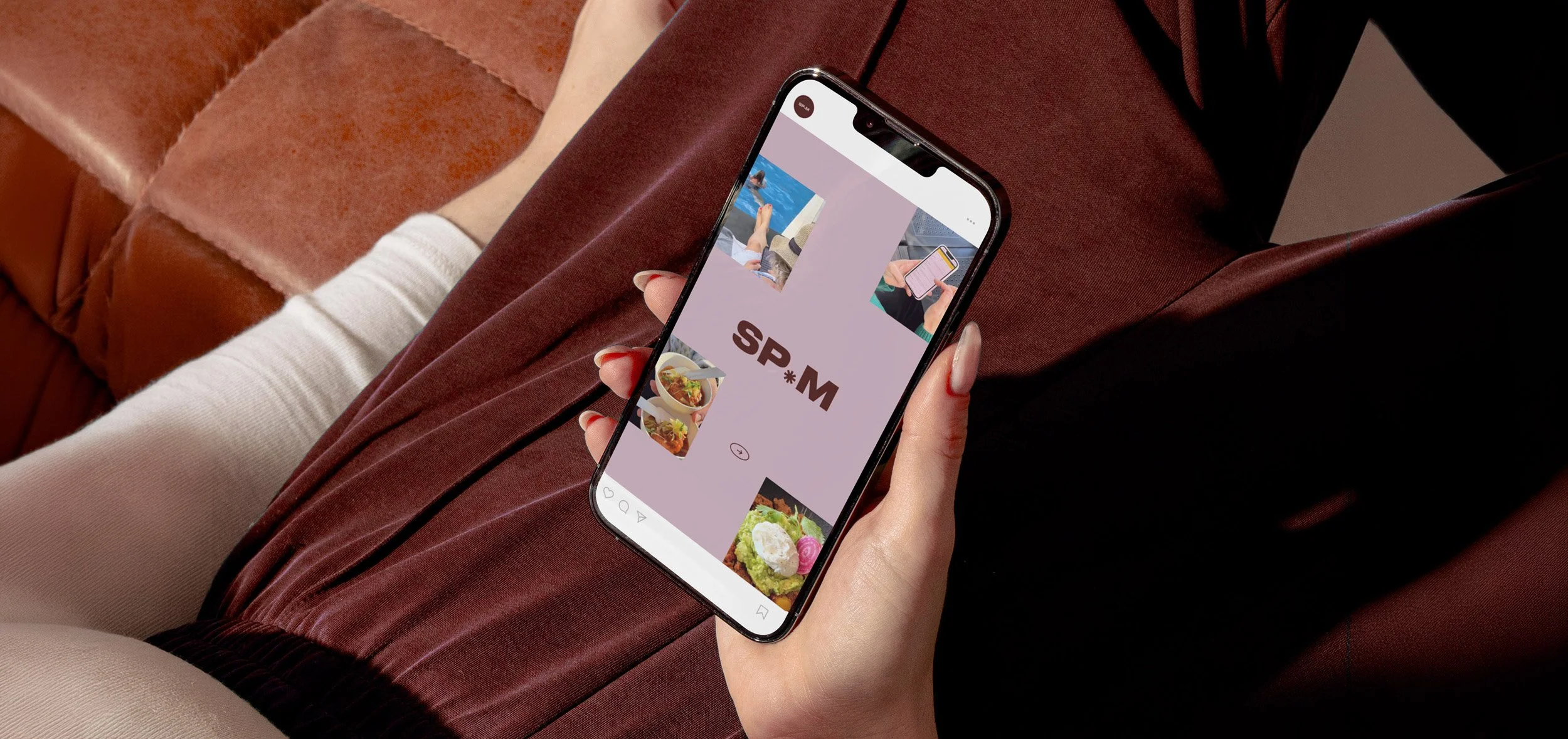 Woman holding mobile phone with branding on the screen that reads SP.M.