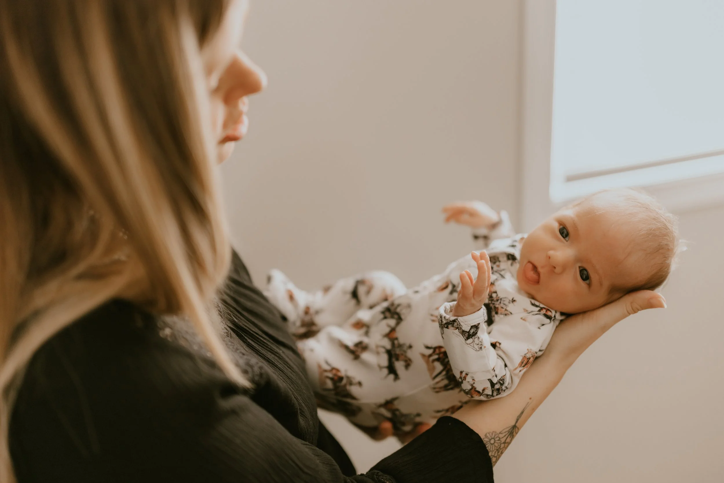 mom holding baby