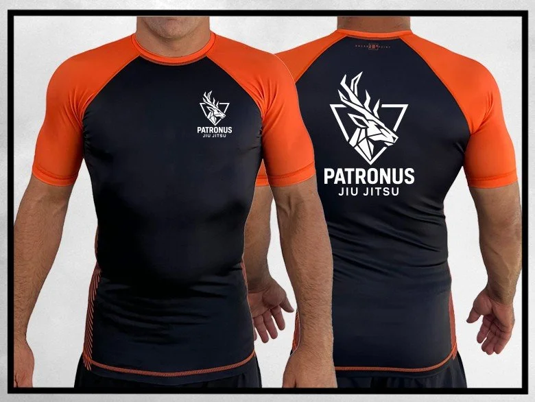 All Black ORANGE Ranked Kids RashGuard Mockup - Patronus Jiu Jitsu.jpg