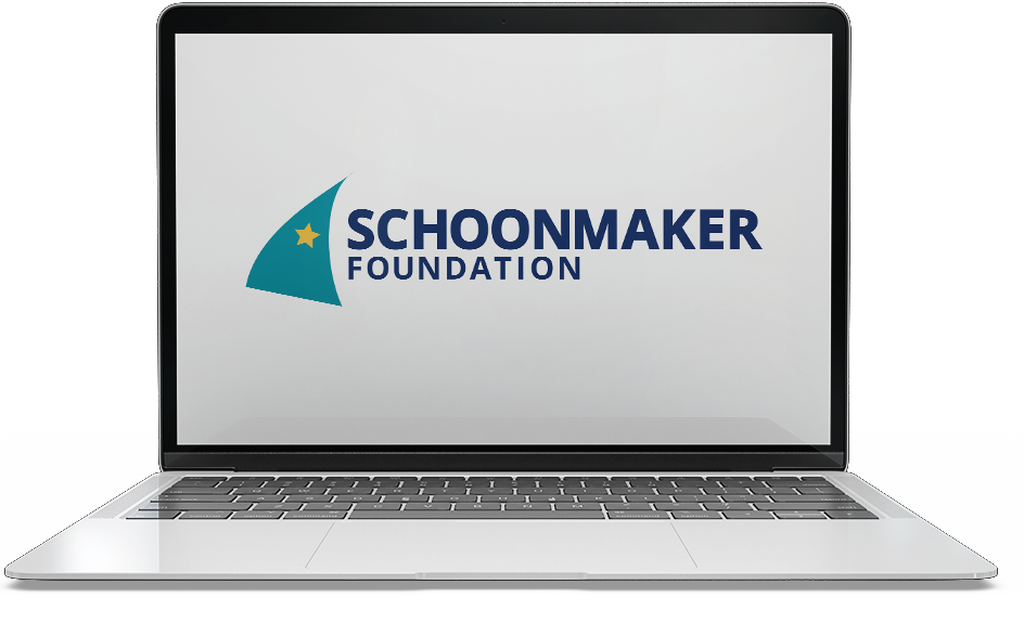 Laptop displaying the Schoonmaker Foundation logo with a stylized sailboat and a star.