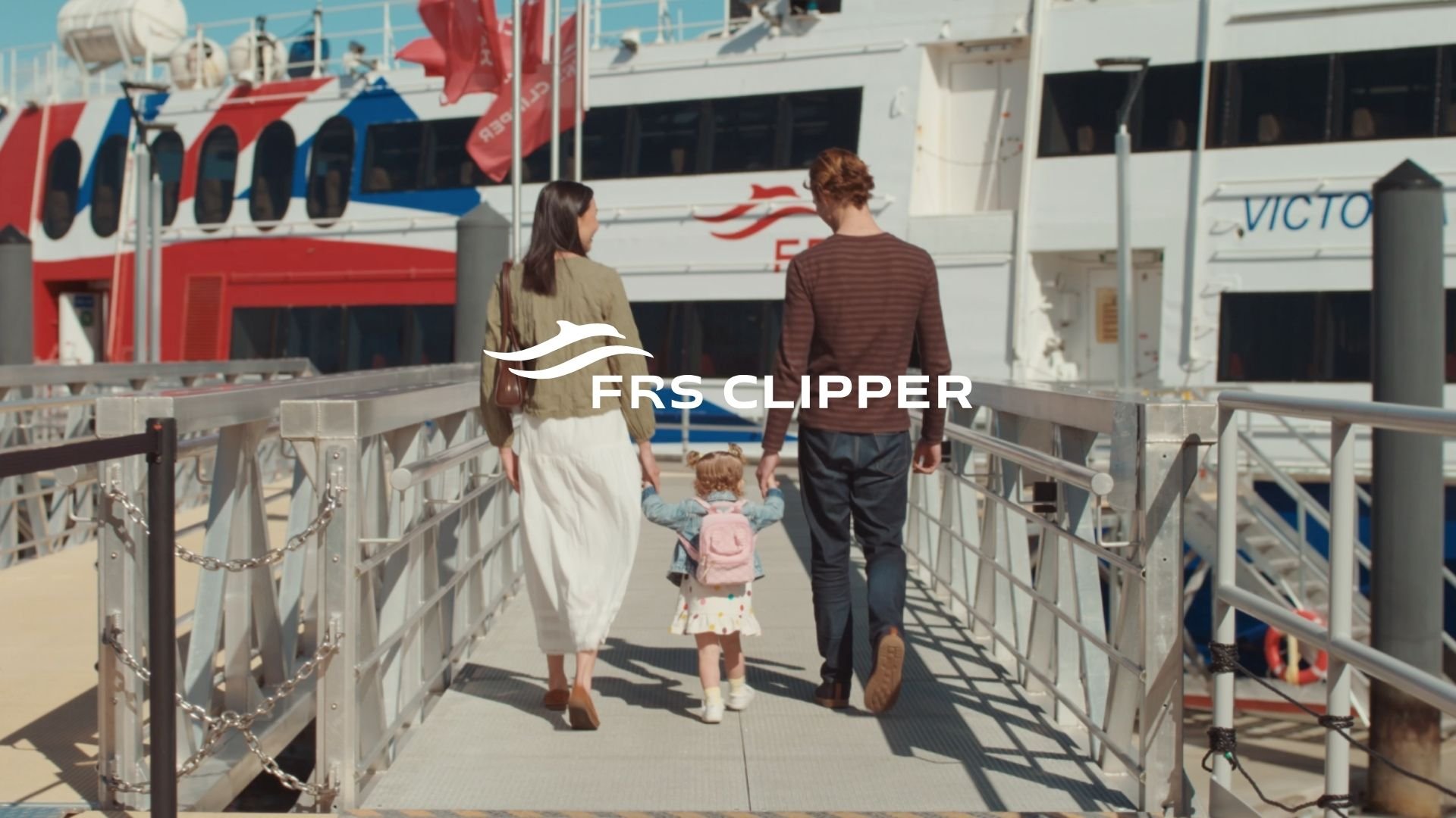 A couple with their daughter are boarding the FRS Clipper for a trip to Victoria BC