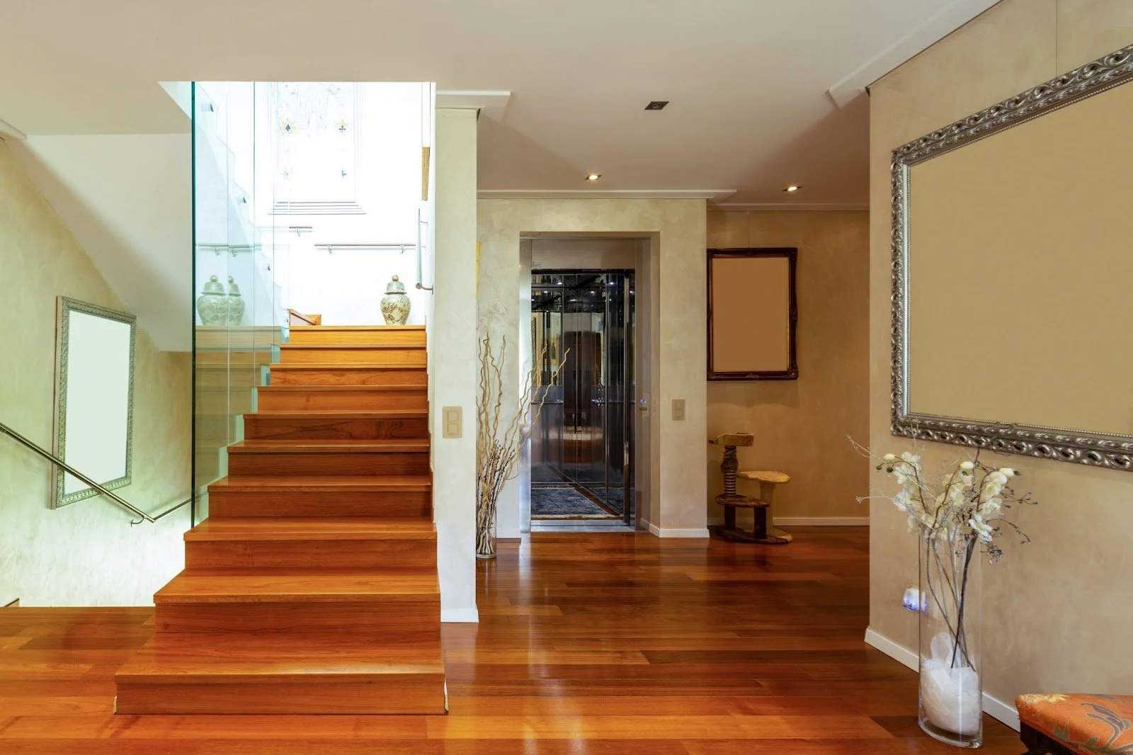 Wooden floor hallway displaying stairlifts and home elevators for accessibility