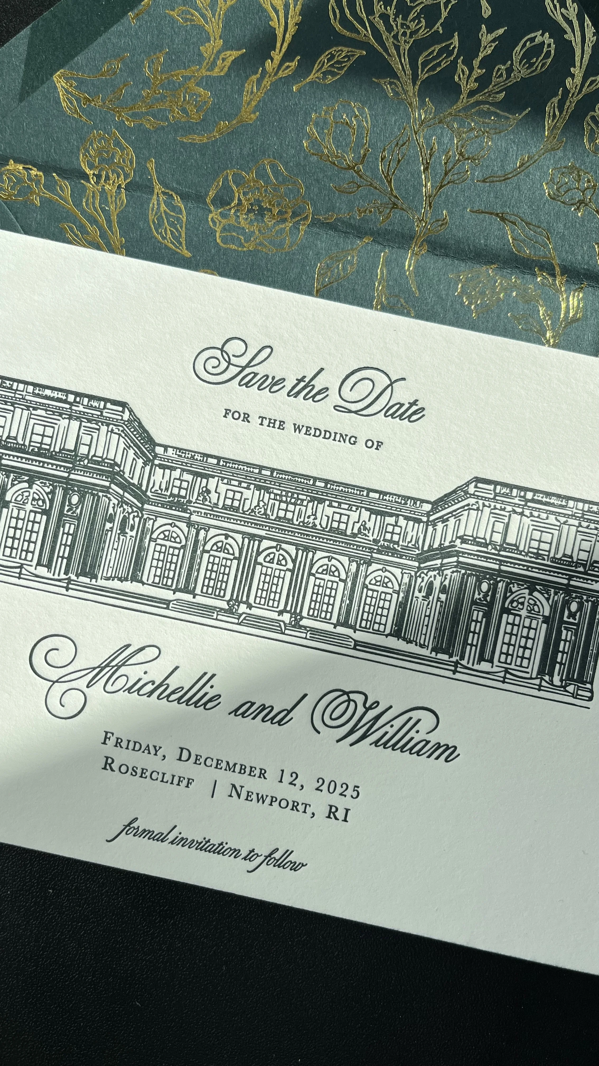 Wedding save-the-date card with detailed illustration of a grand historic building and elegant cursive text, set against a dark background with a decorative green and gold floral overlay.