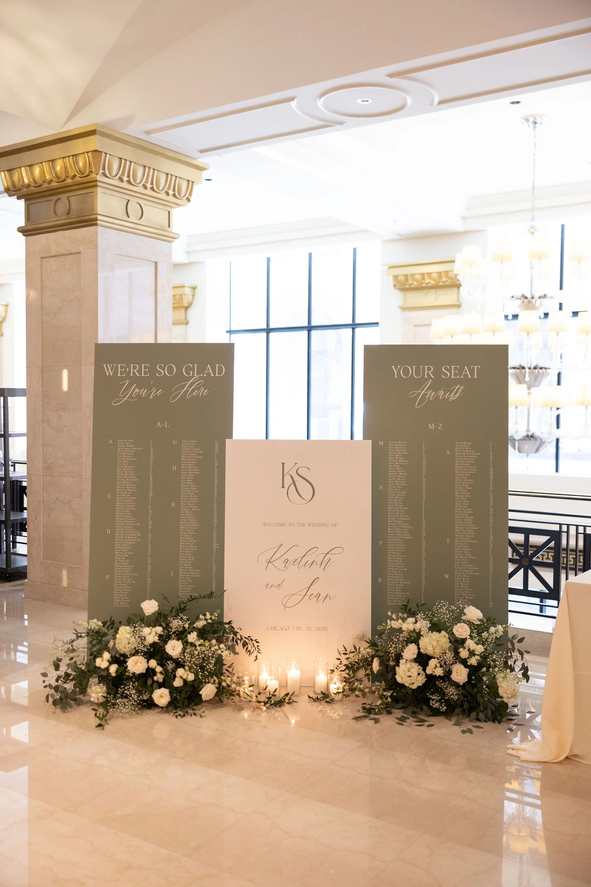 Wedding reception seating chart display with flowers and candles, welcoming guests to the wedding of Kadijah and Sean in Chicago.