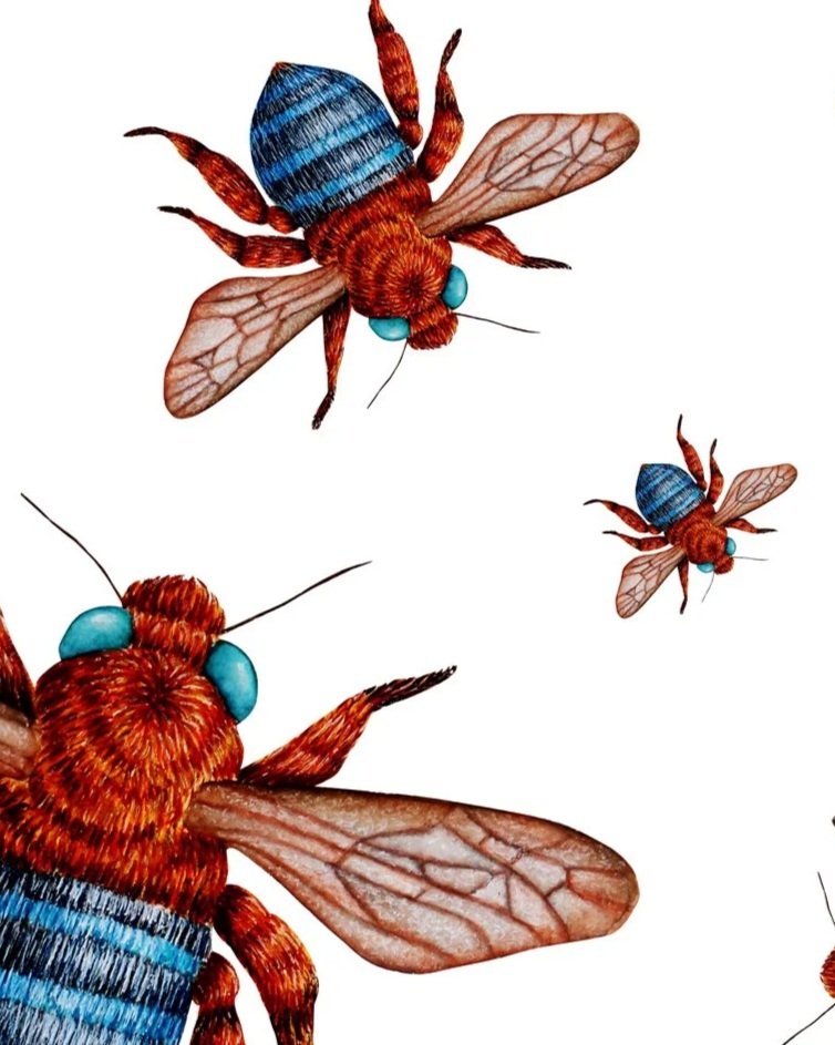 Close up of hand-painted bee artwork showing detailed bees with blue-banded bodies and translucent wings scattered across a white background.