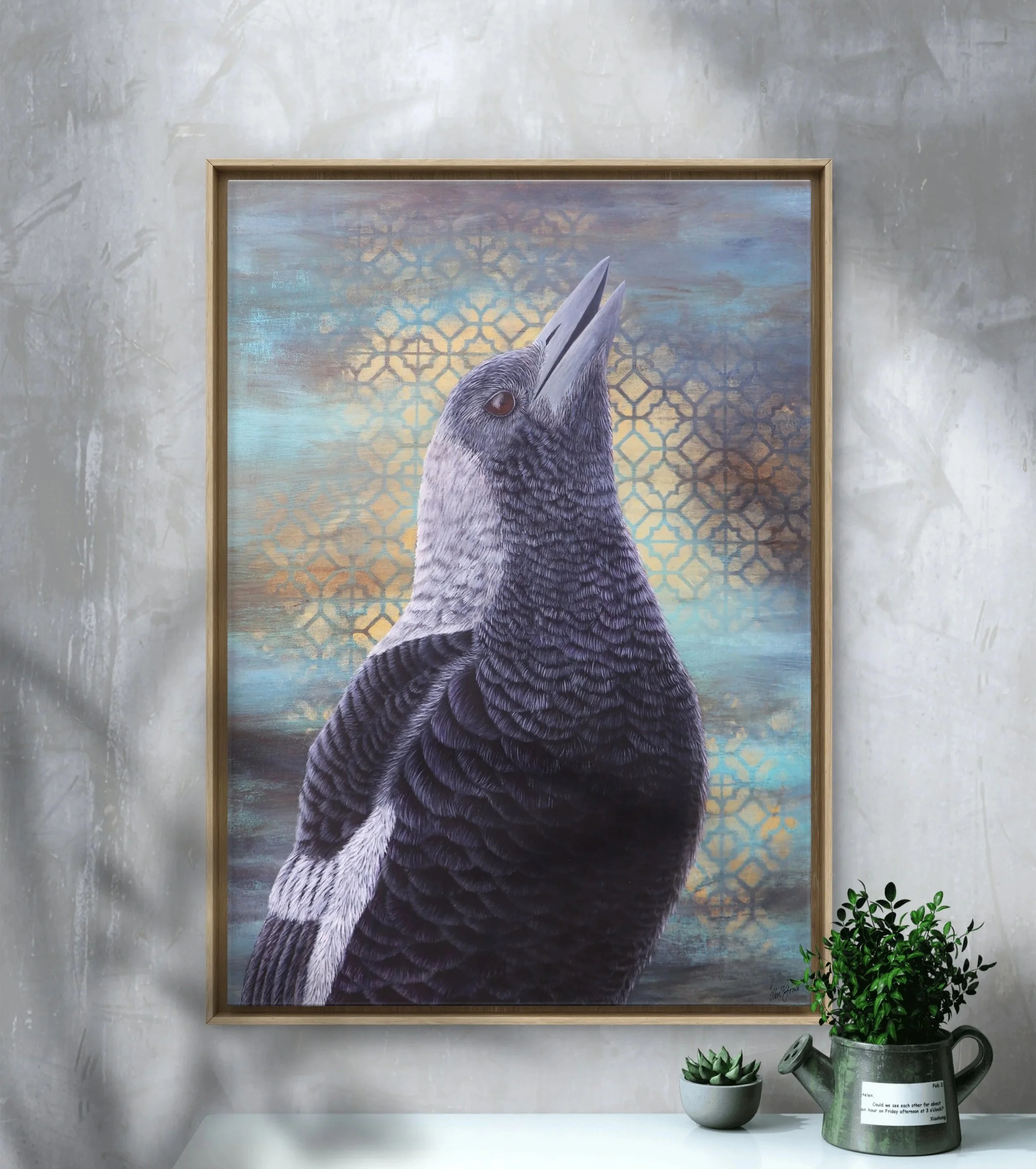 Framed painting of an Australian magpie with detailed black and white feathers, head raised as if calling, set against a textured blue and gold patterned background.