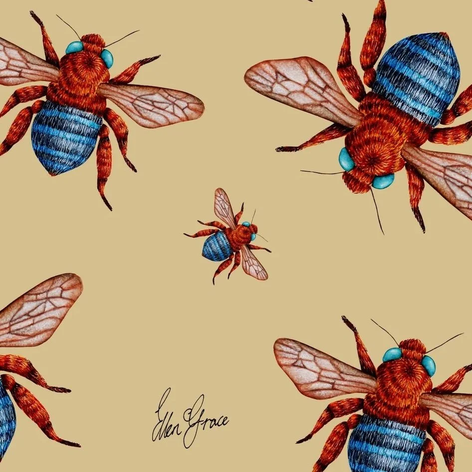 close up shot of hand-painted bee artwork showing detailed bees with blue-banded bodies and translucent wings scattered across a warm ochre background.