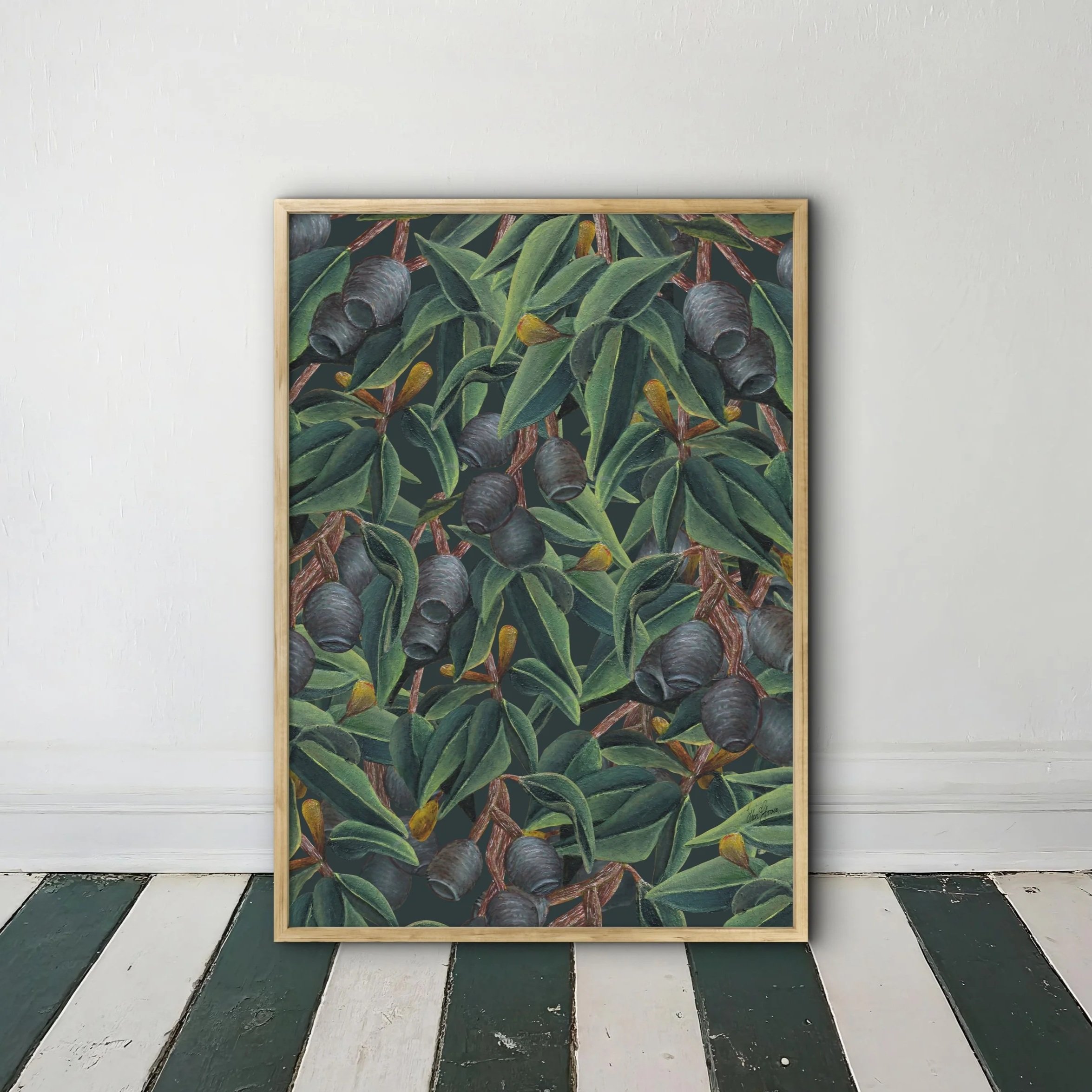 Framed botanical illustration of eucalyptus leaves and gumnuts arranged in a pattern on a deep emerald, green background.