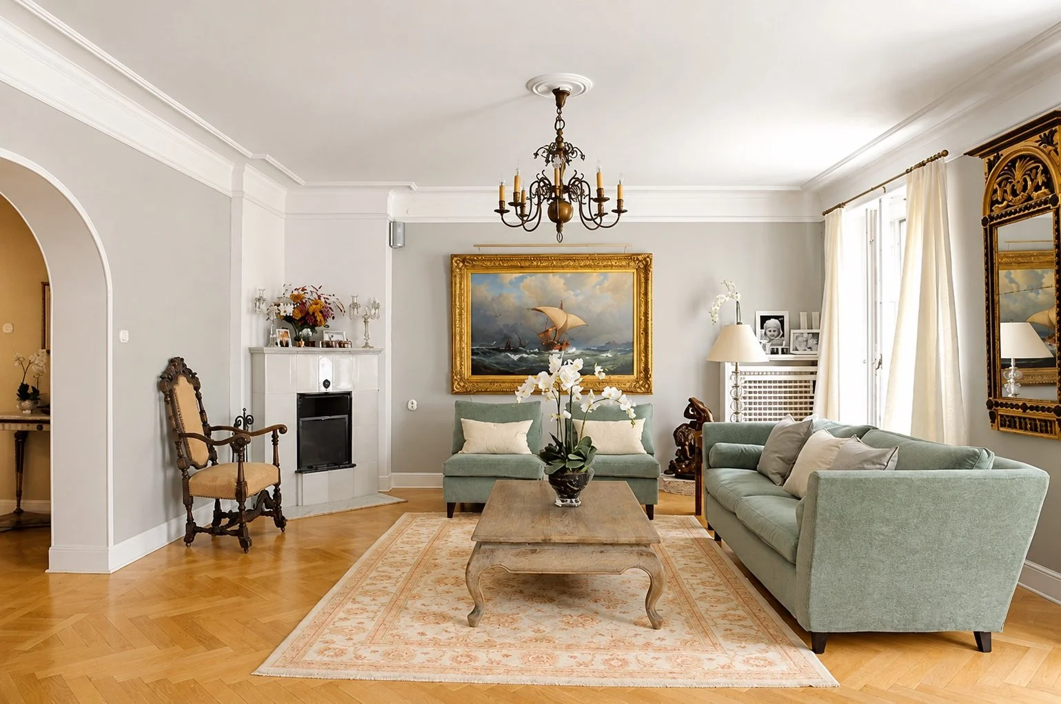 Luxury apartment salon in Stockholm designed by MIDA Interiors, featuring elegant period detailing, curated antiques, bespoke upholstery, parquet flooring and a refined neutral palette.