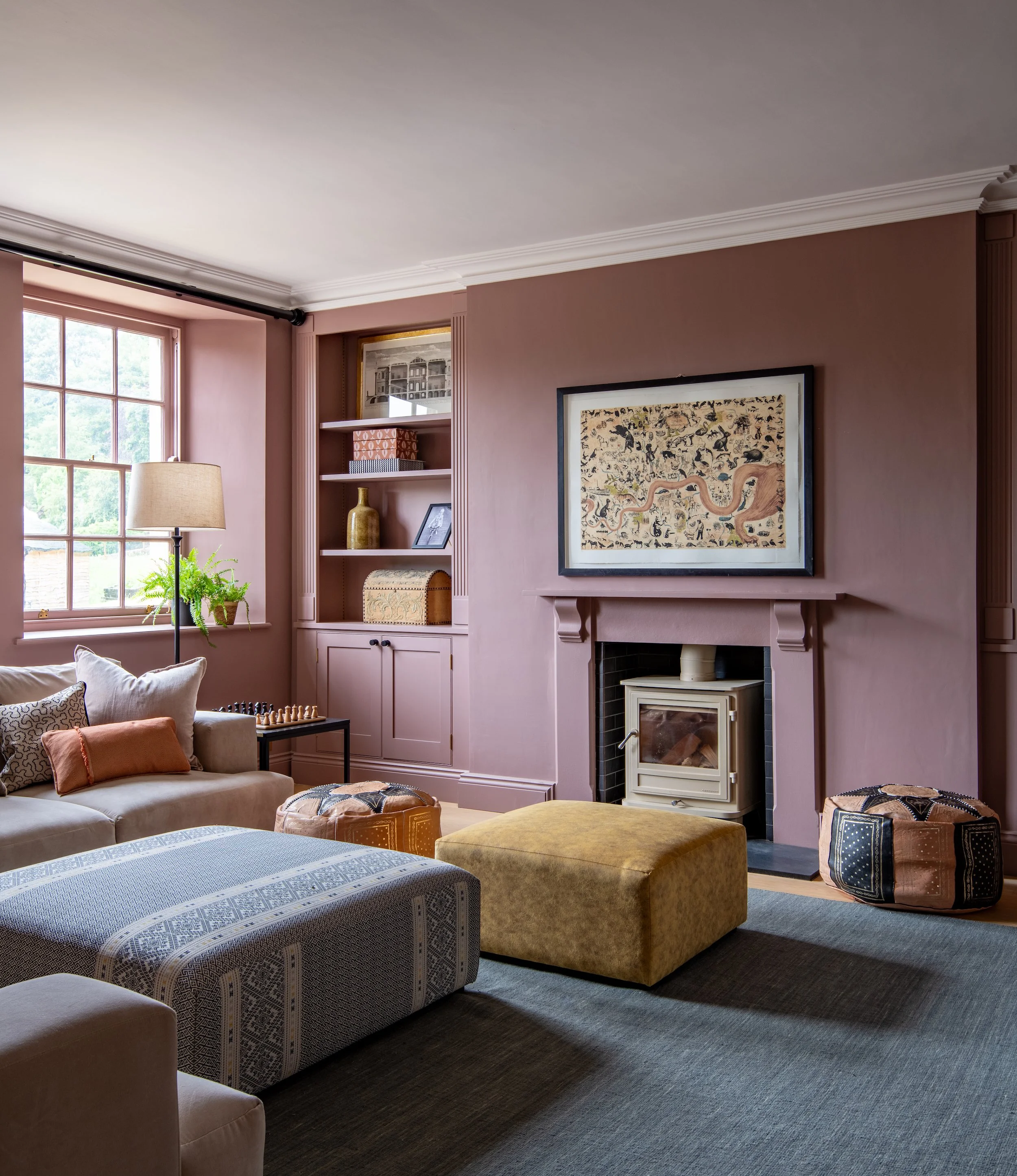 Playroom and cinema room designed by MIDA Interiors for a large Cotswolds country estate, featuring bespoke joinery, flexible family seating, adaptable lighting and an enveloping colour palette for daytime play and intimate film nights.