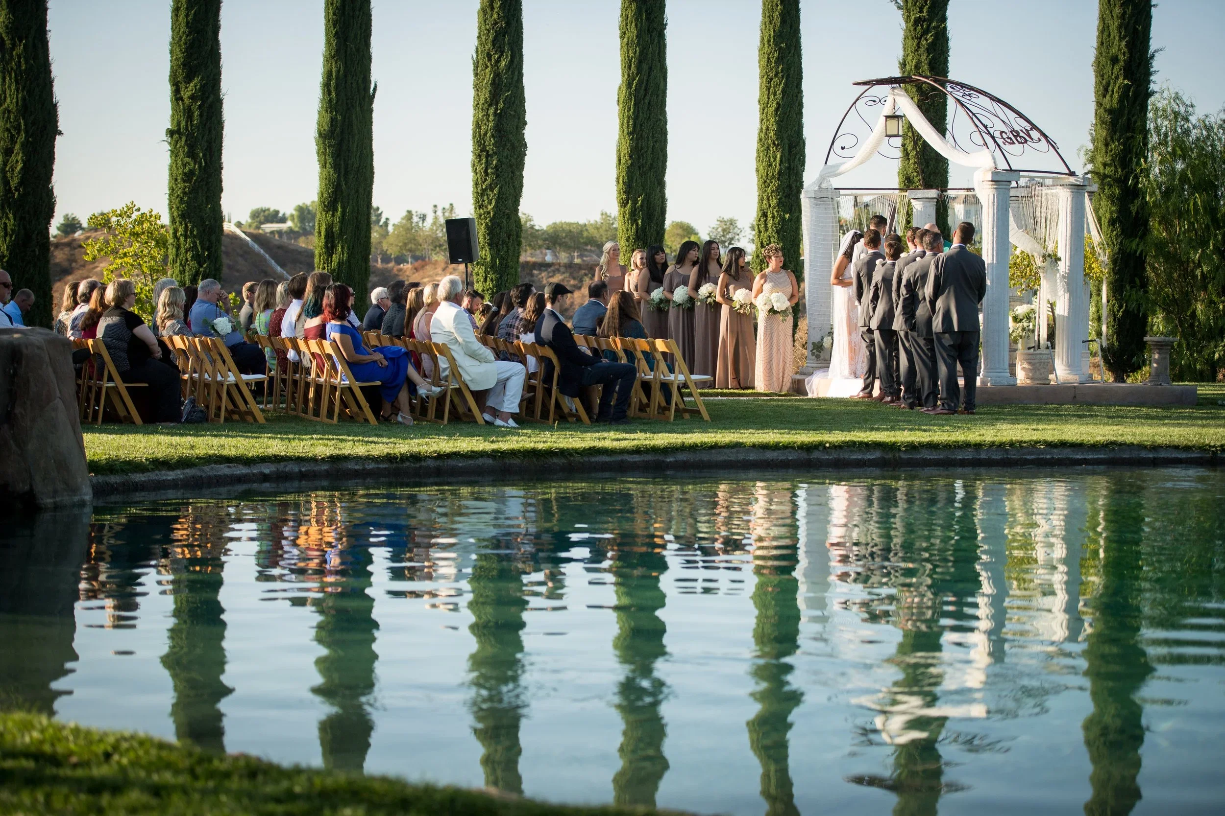 Romantic wineries in Temecula at Gershon Bachus Vintners with vineyard ceremony views and pond