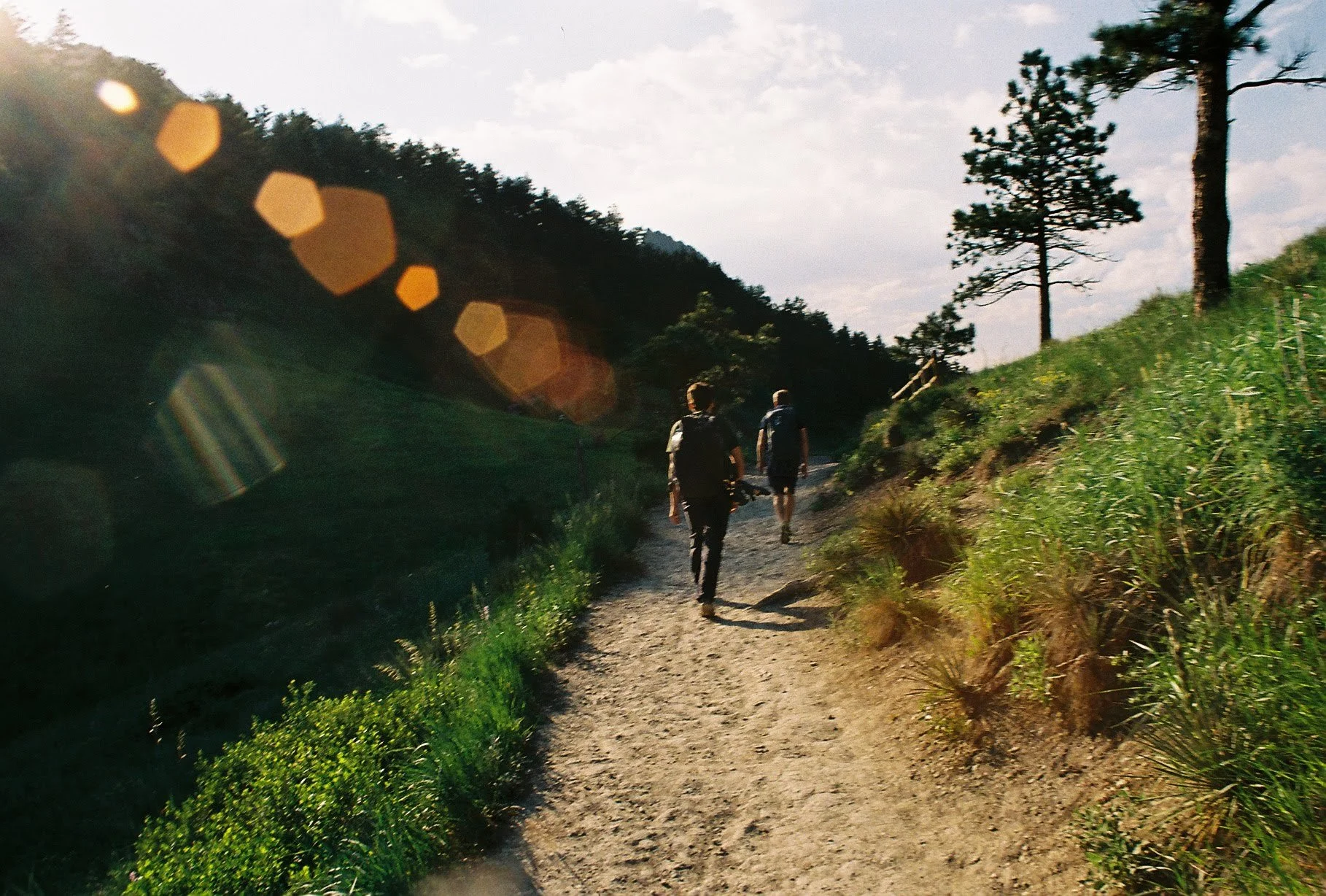 charlie and bryan on the way to climb at dinosaur rock. probably 2019. taken on a disposable camera