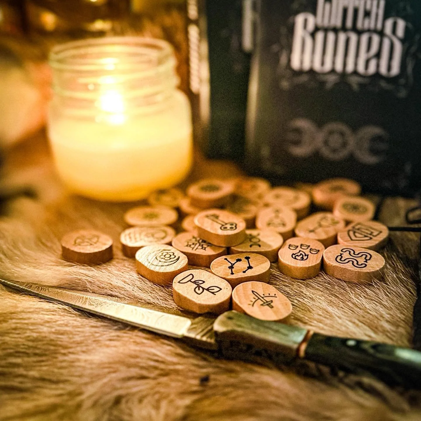 Witch Runes: rune discs, a candle and an athame with the box