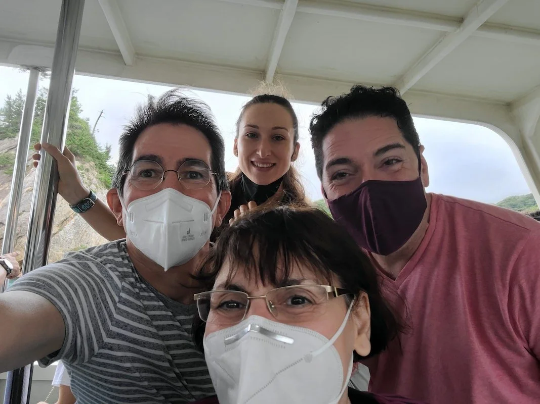 An image of 4 people who are wearing masks.