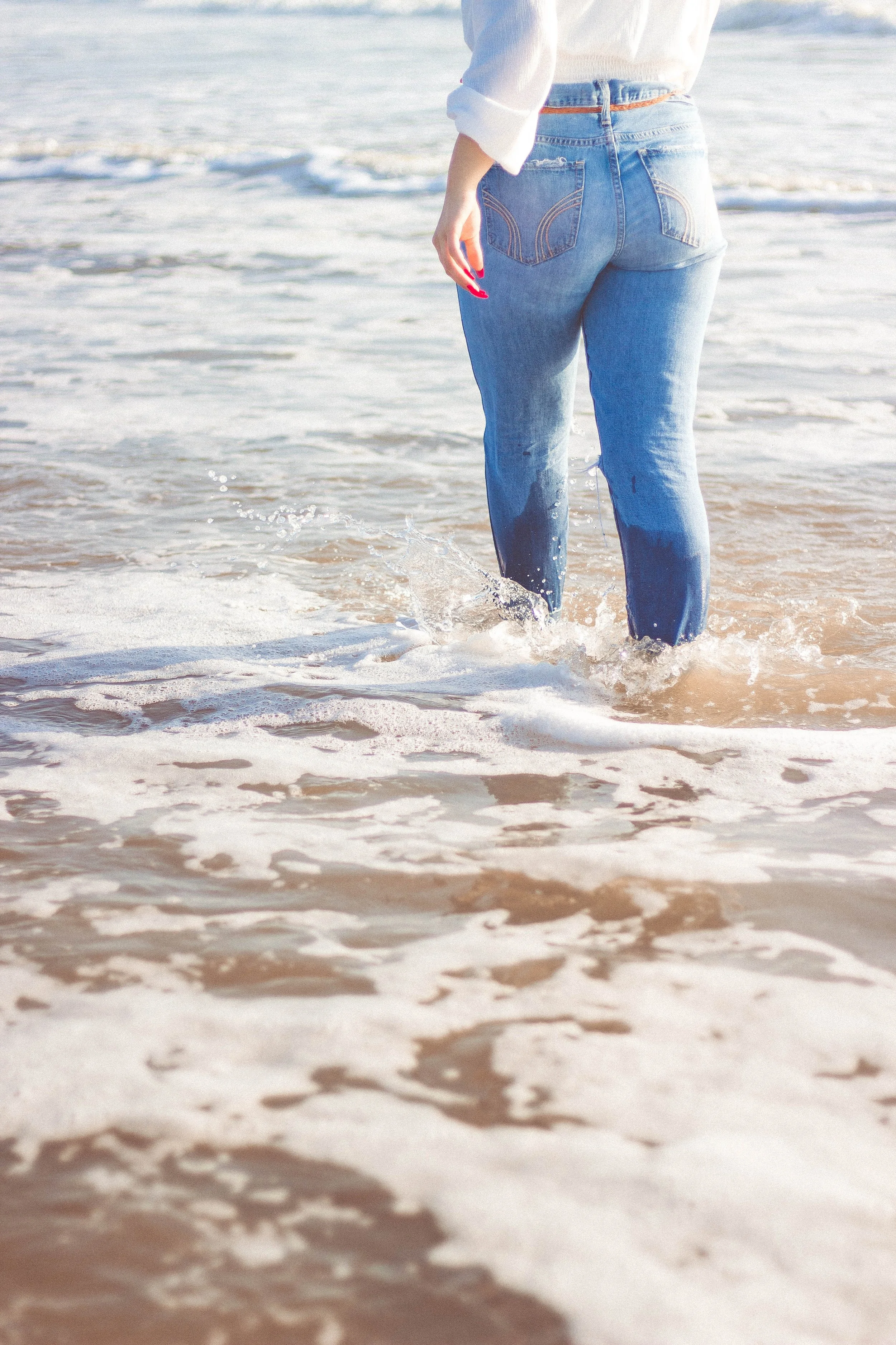 Abby walking in water St. Augustine Beach Florida senior photos