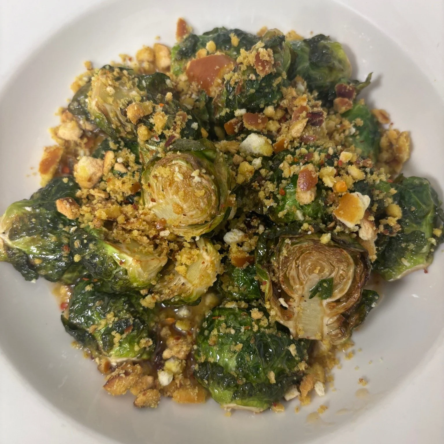 brussel spouts with honey mustard pretzel dust and spicy honey