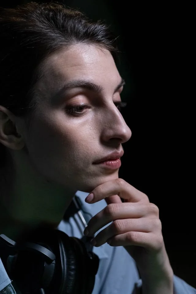 side view person's face with thoughtful expression