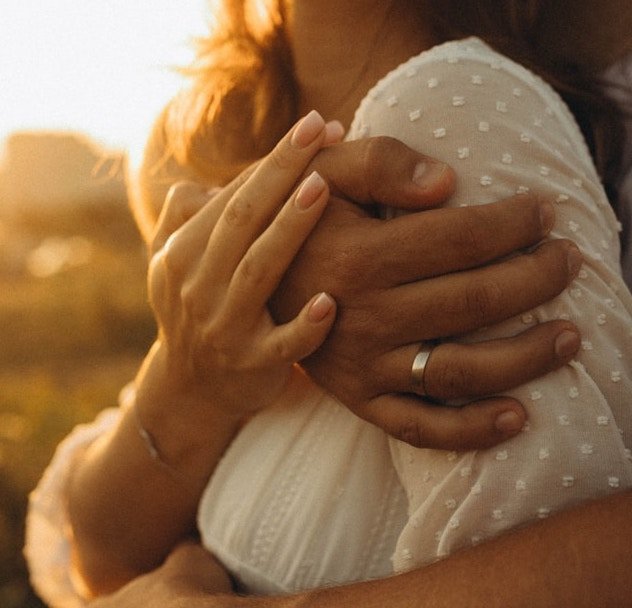 A couple hugging up close