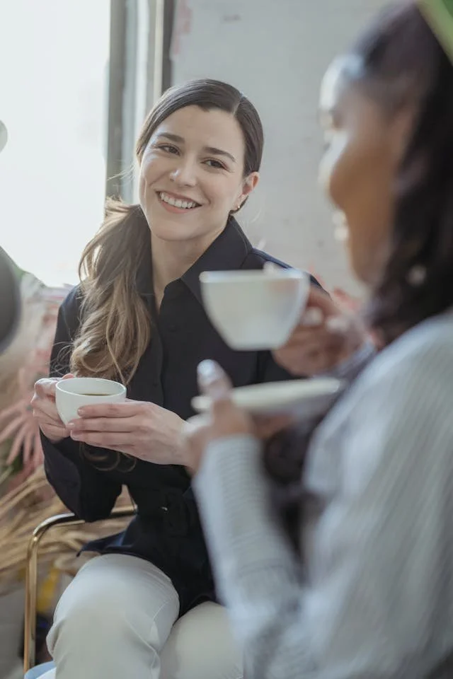 a woman having coffee with friends