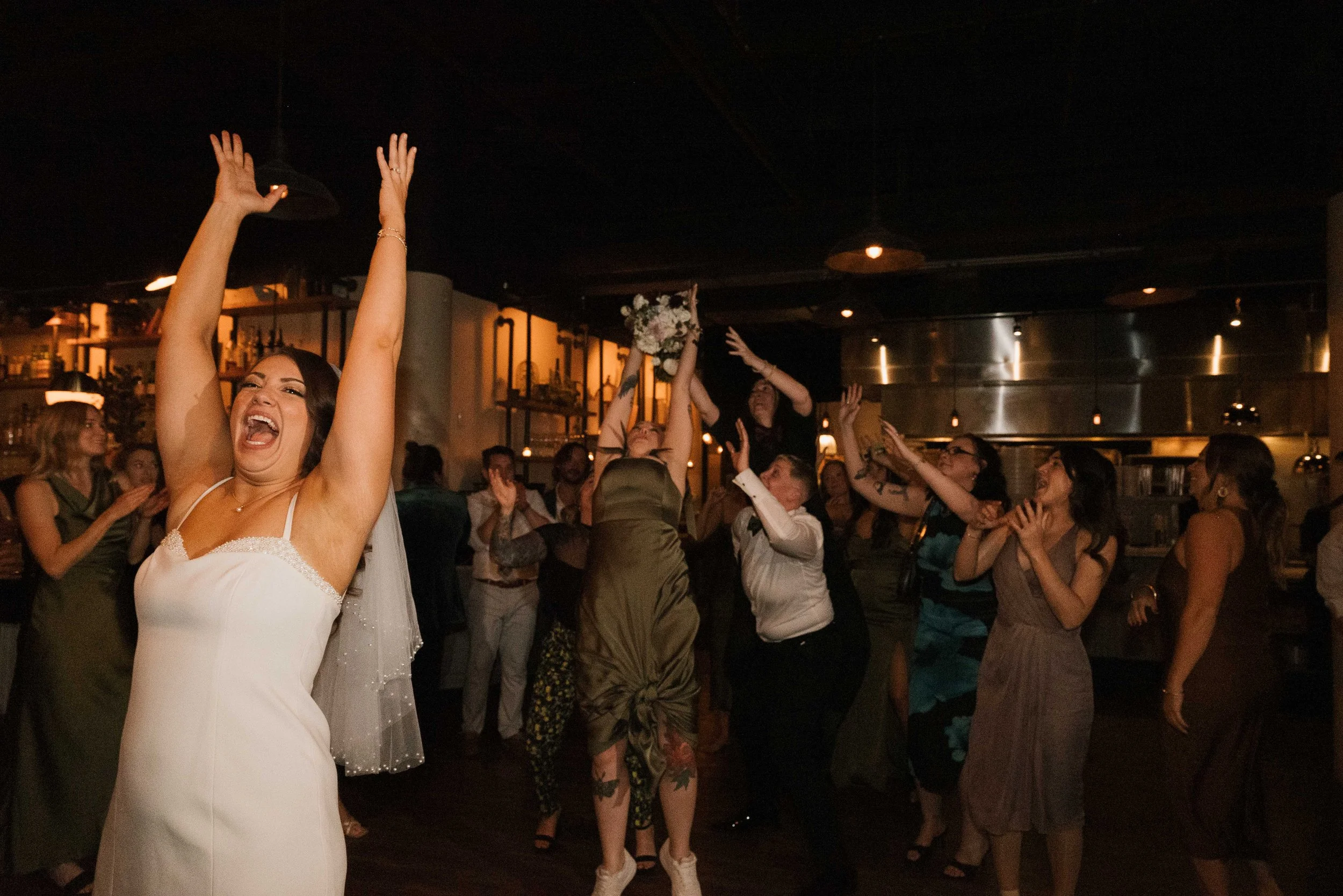  A full restaurant buyout reception at Osteria in Philadelphia with candlelit tables, Italian food, and a lively dance floor. 