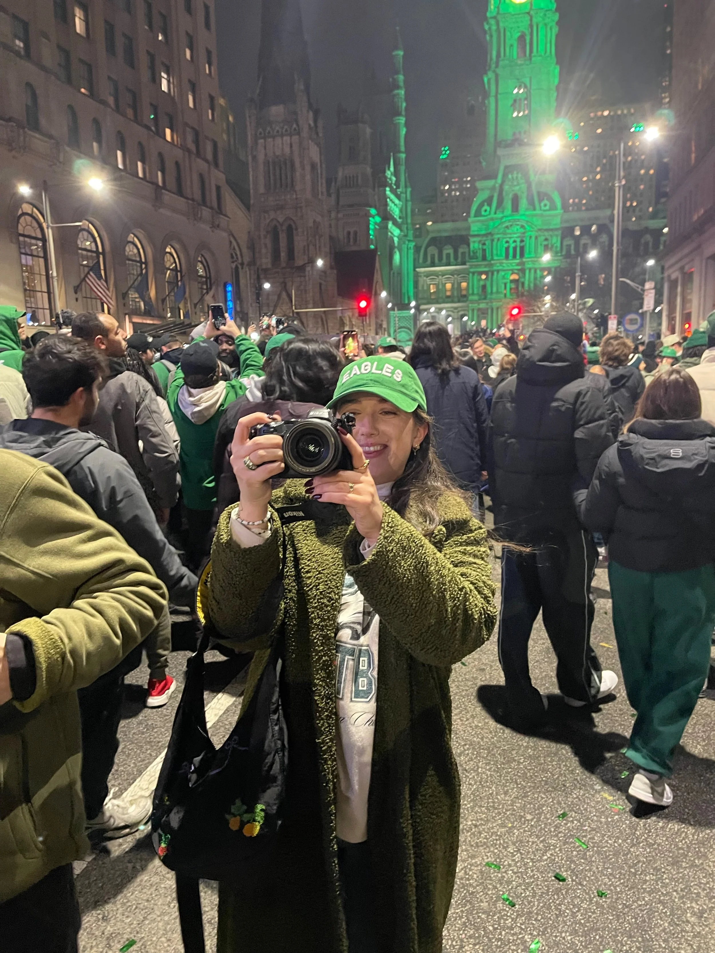 Erin Marhefka Photographer standing on Broad Street in Philadelphia after the Philadelphia Eagles Won the Superbowl, Photographing the Events