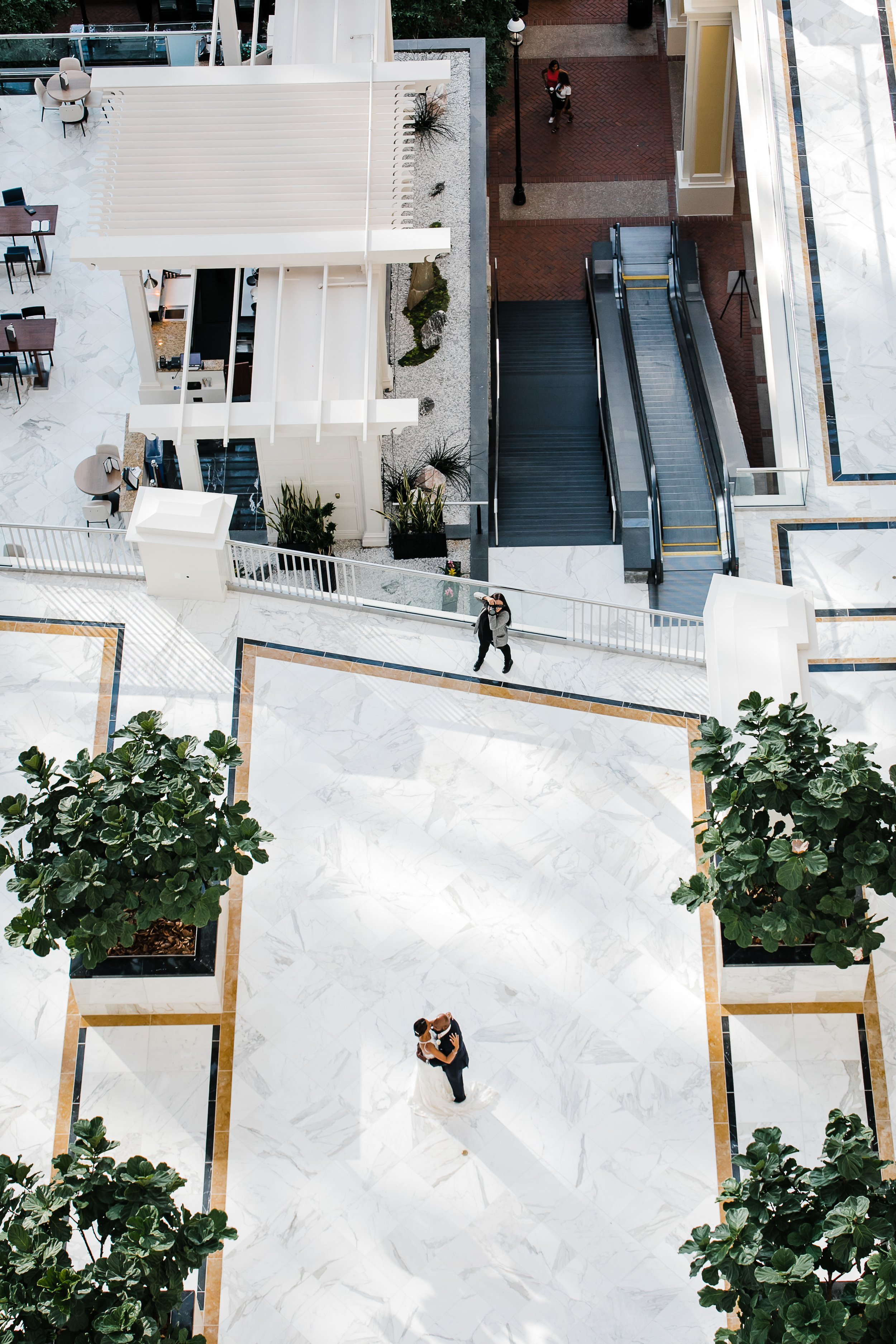  view from above, wedding photographer with couple at gaylord national harbor 