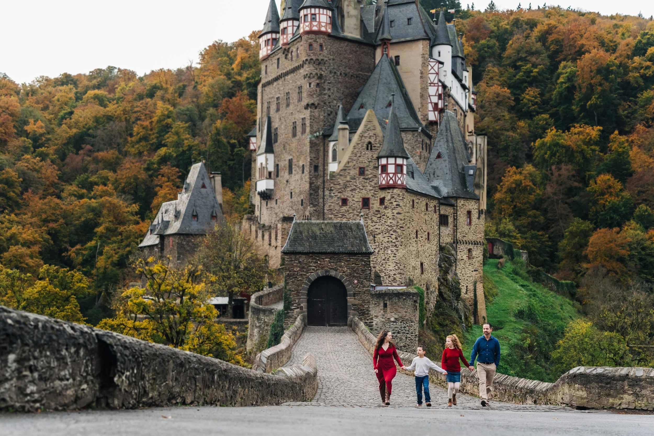 Wide view of Burg Eltz castle during a family photography session in Germany